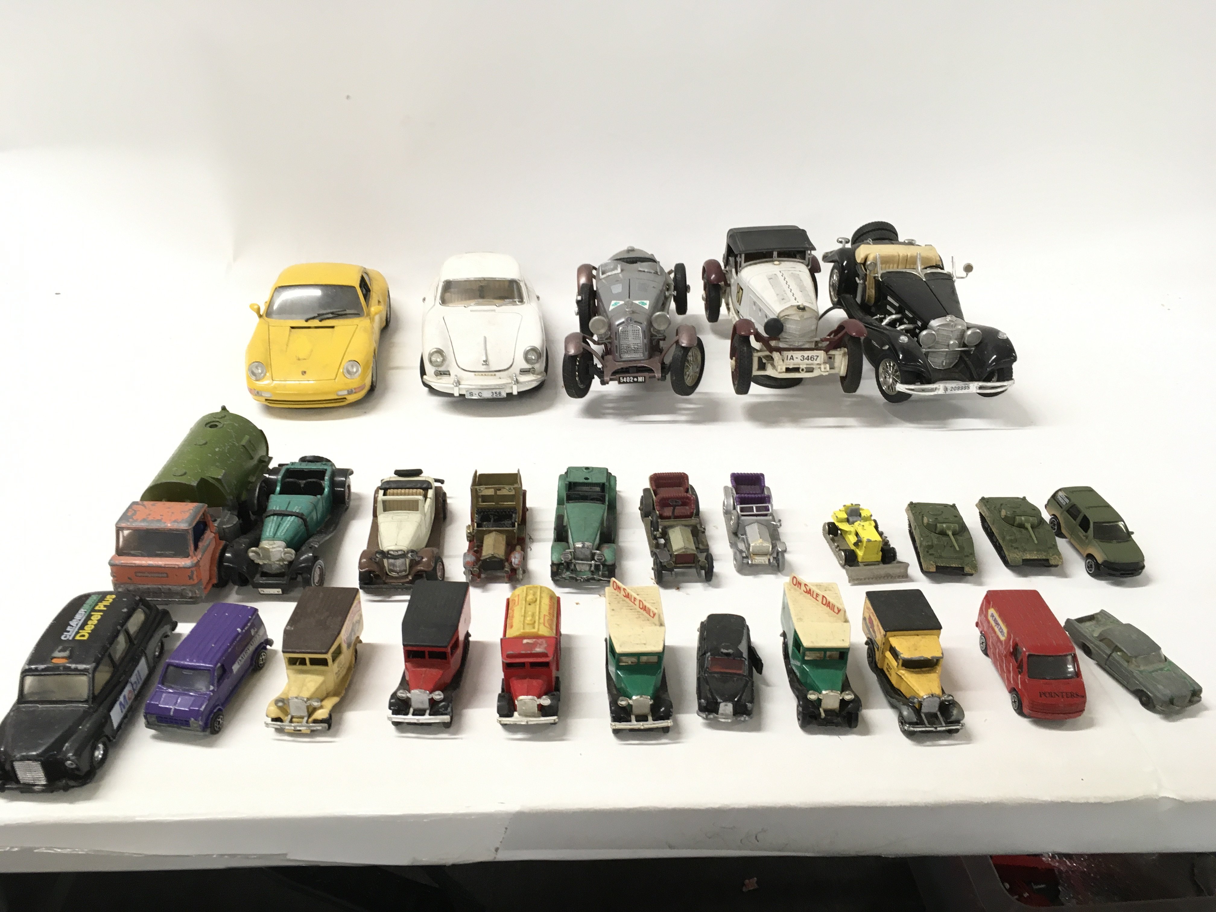 A collection of Playworn model vehicles from various manufacturers including burago..Dinky..Corgi etc. No reserve.