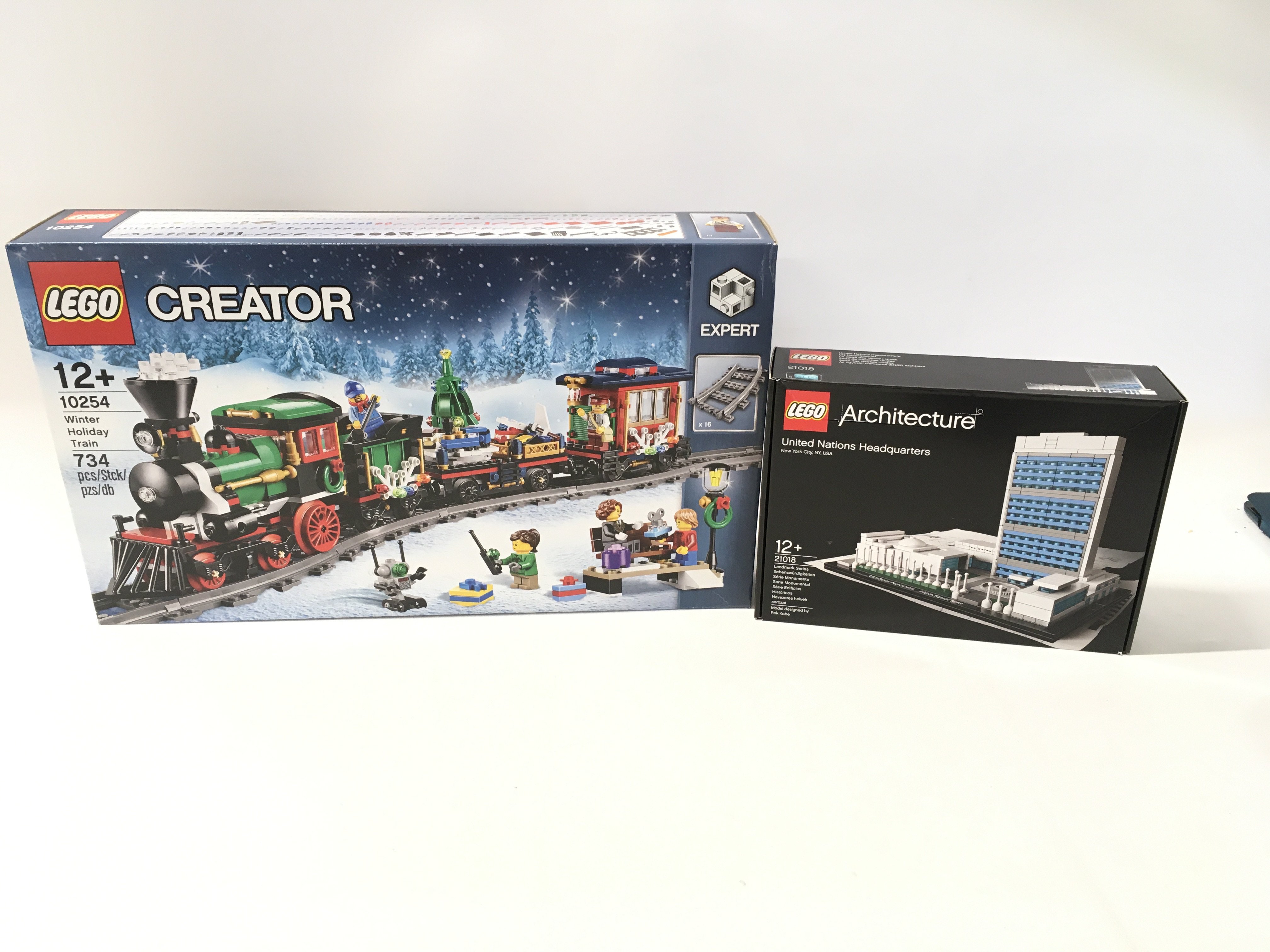 2x sealed boxed Lego sets including ARCHITECTURE # 21018. United Nations Headquarters. Also CREATOR # 10254 Winter Holiday Train. No reserve