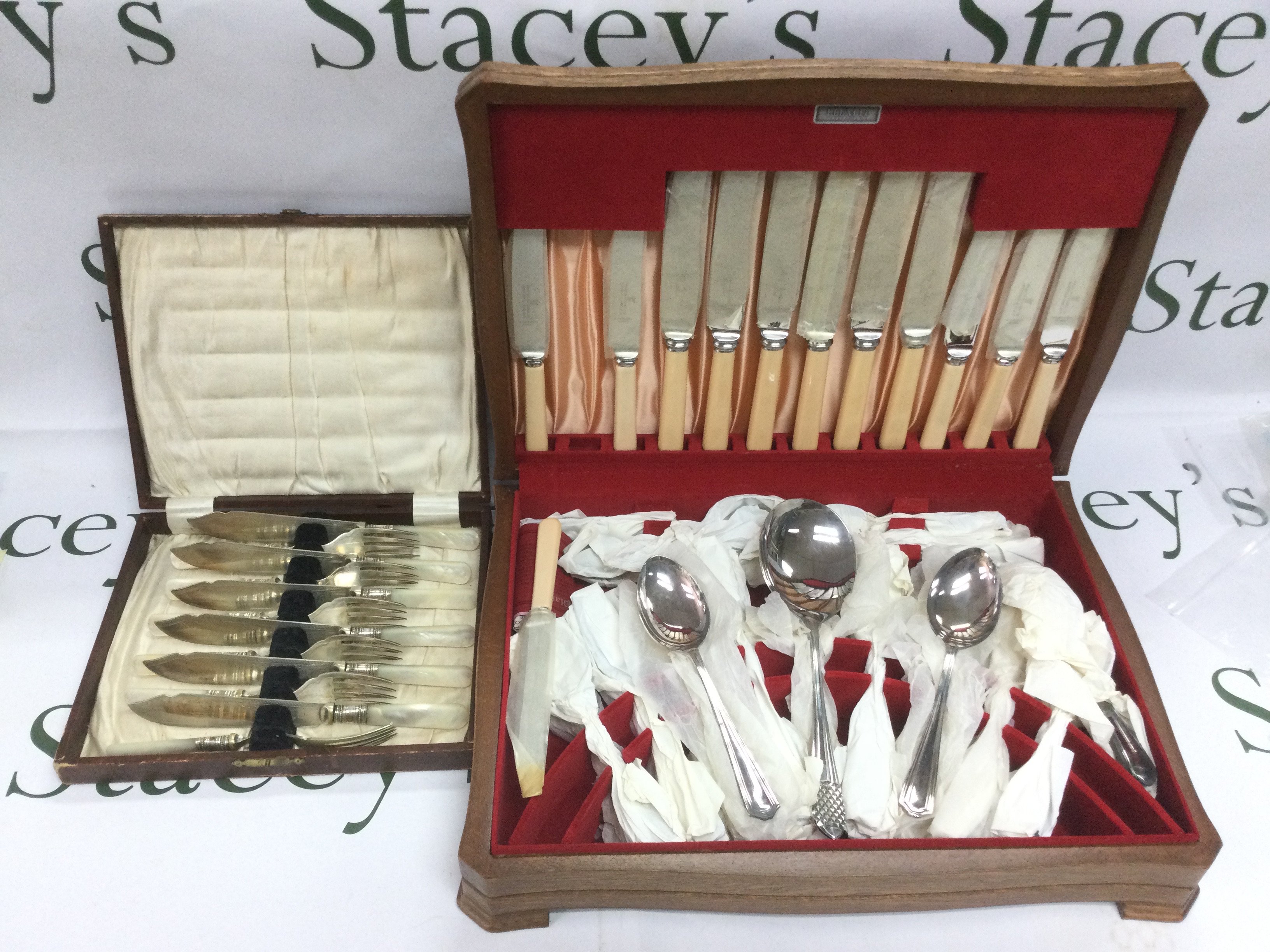 A vintage silver plated canteen of cutlery and a cased fish set (2). Shipping category D.