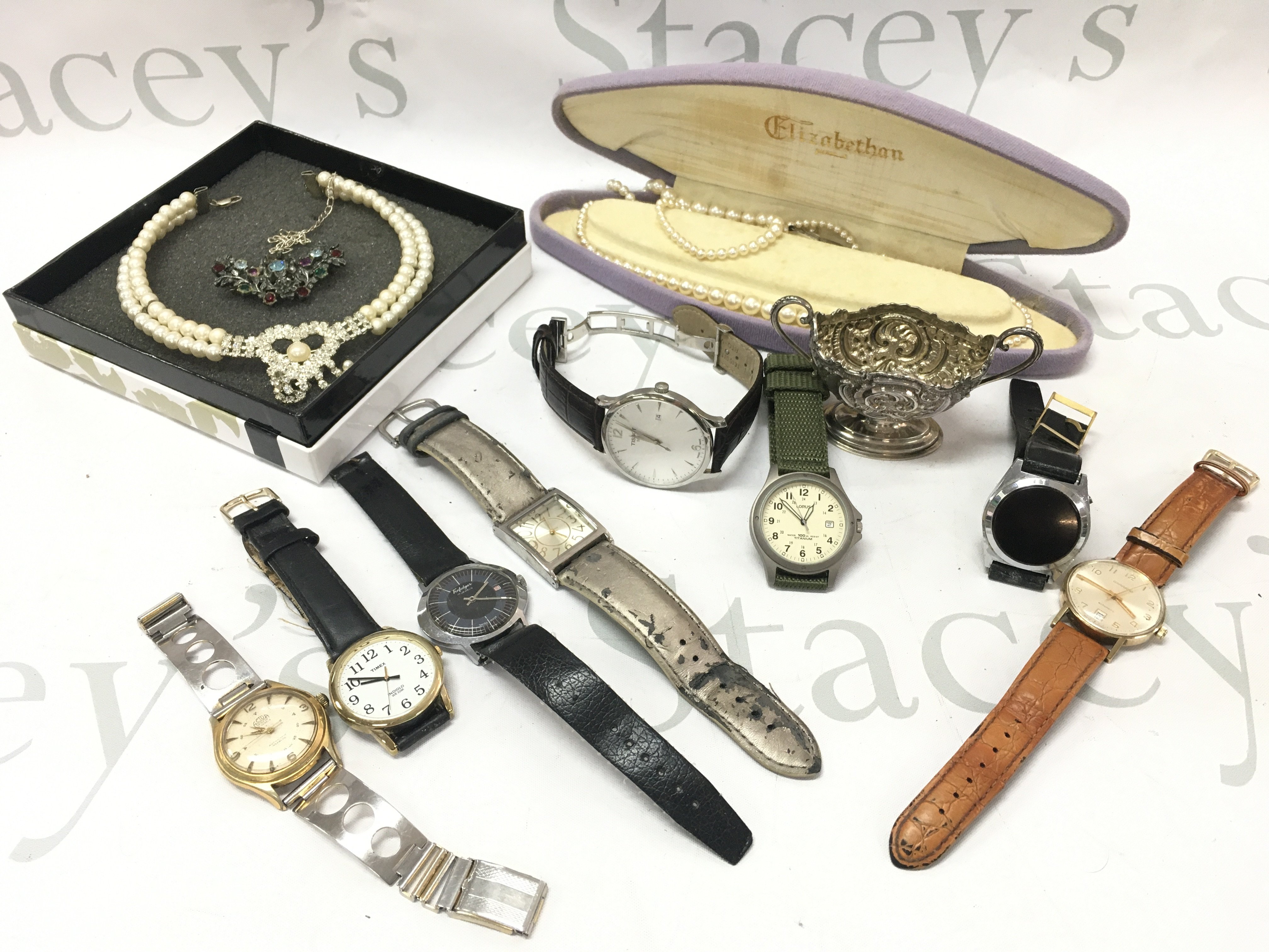 A collection of vintage gents watches including Garrand, Actua, Timex, Trafalgar, Tissot and pearl necklaces. Postage category B