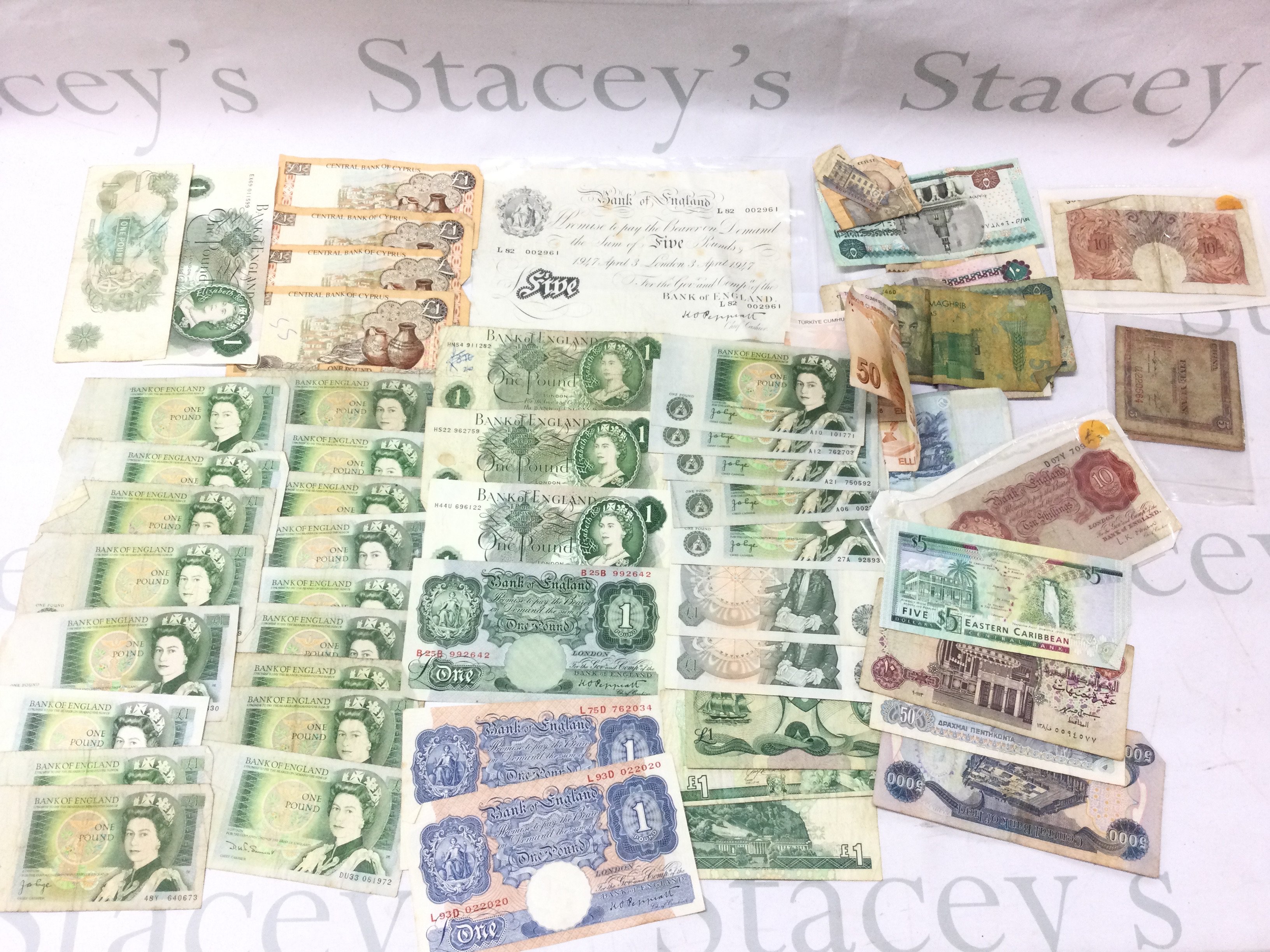 A large collection of uk and world bank notes including a white &#20132662755 note Postage A