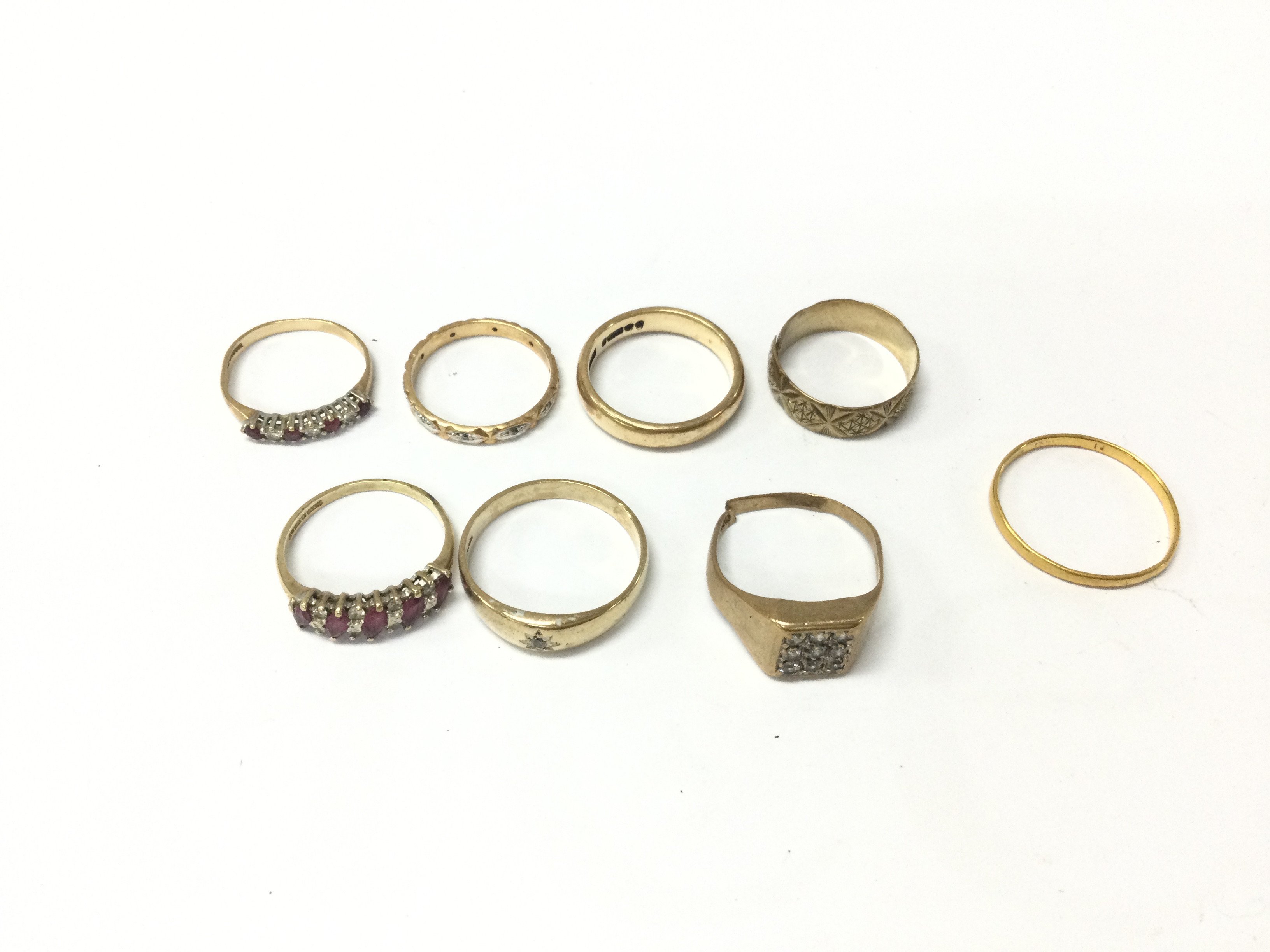 A collection of 7 9ct gold rings 16.22g of various designs and 1 22ct gold 1.59g