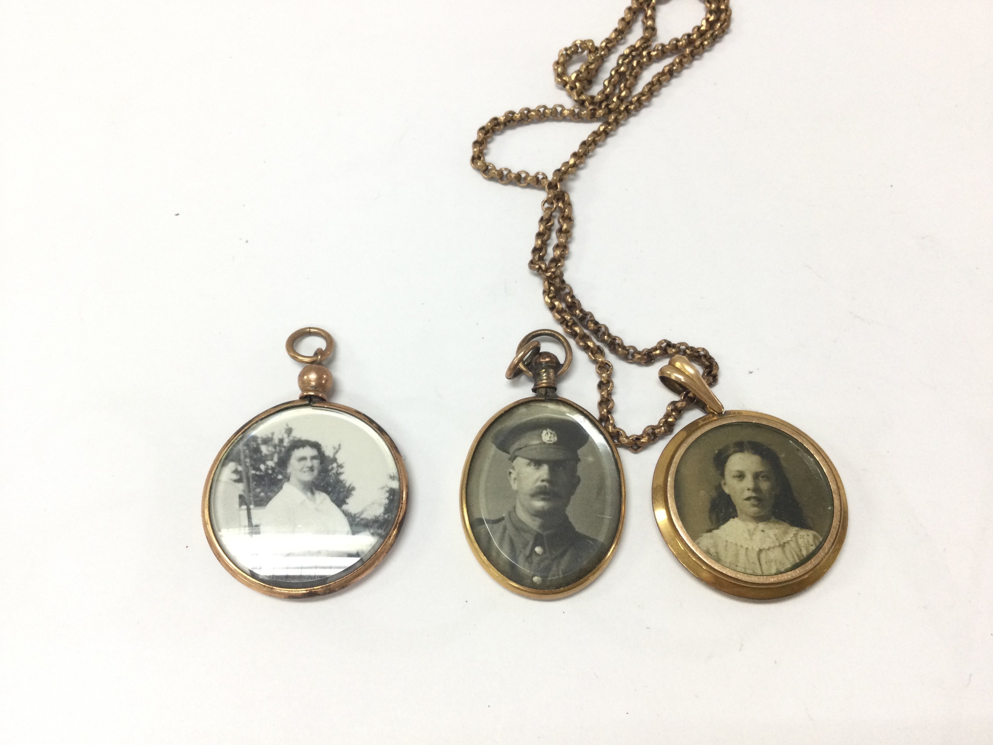 Three vintage lockets one with chain. Postage B