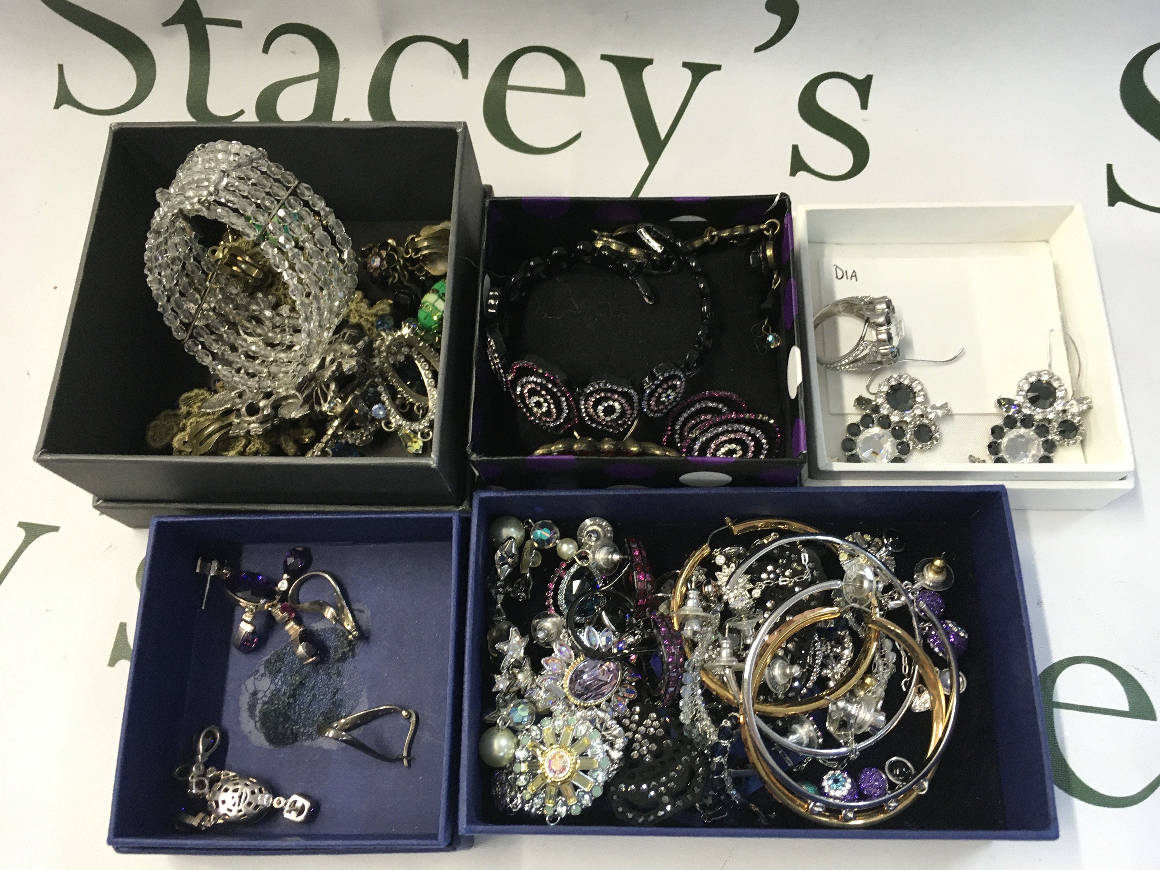 A collection of costume jewellery including Swarovski, Dior . Postage category b