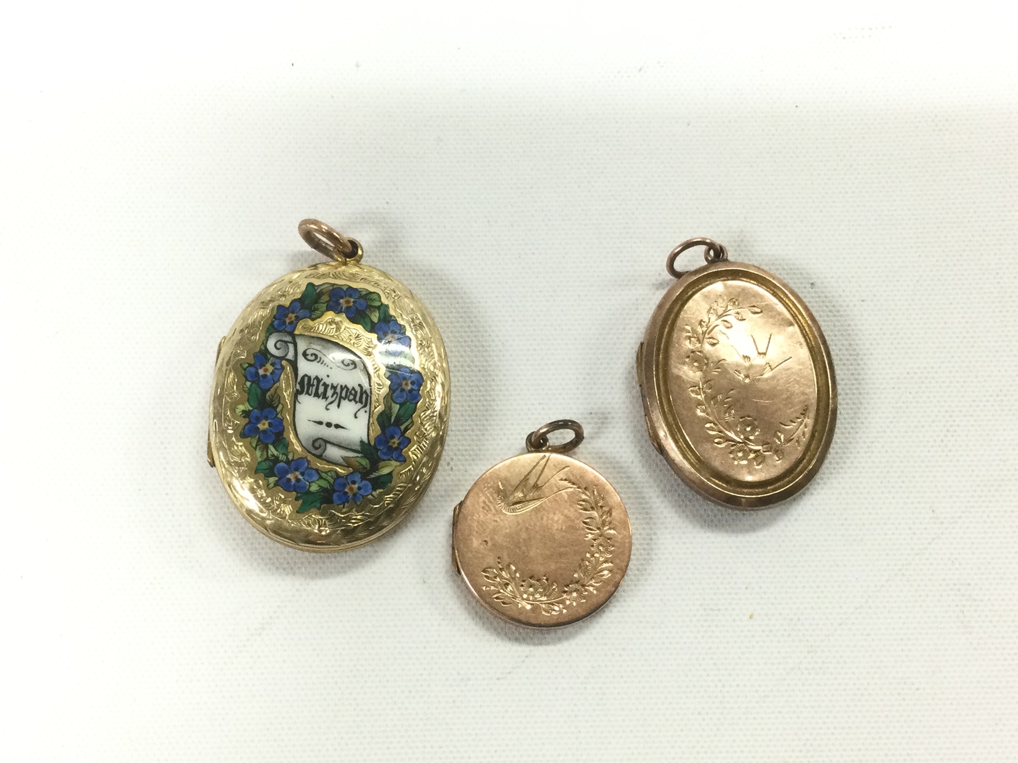 Three lockets including gold plated examples. Shipping category A.