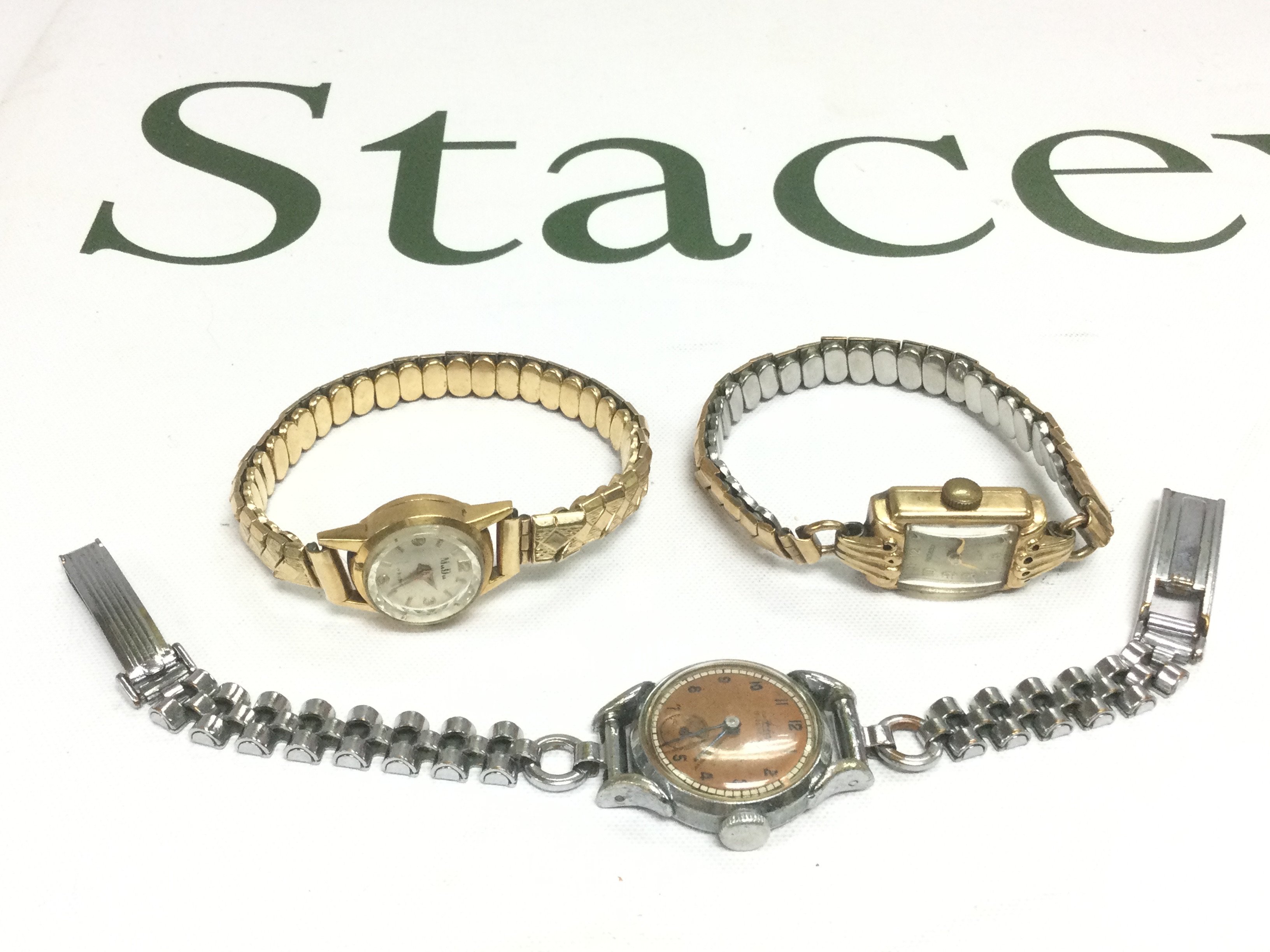 Three ladies watches comprising two gold cased examples and one other. Shipping category A.