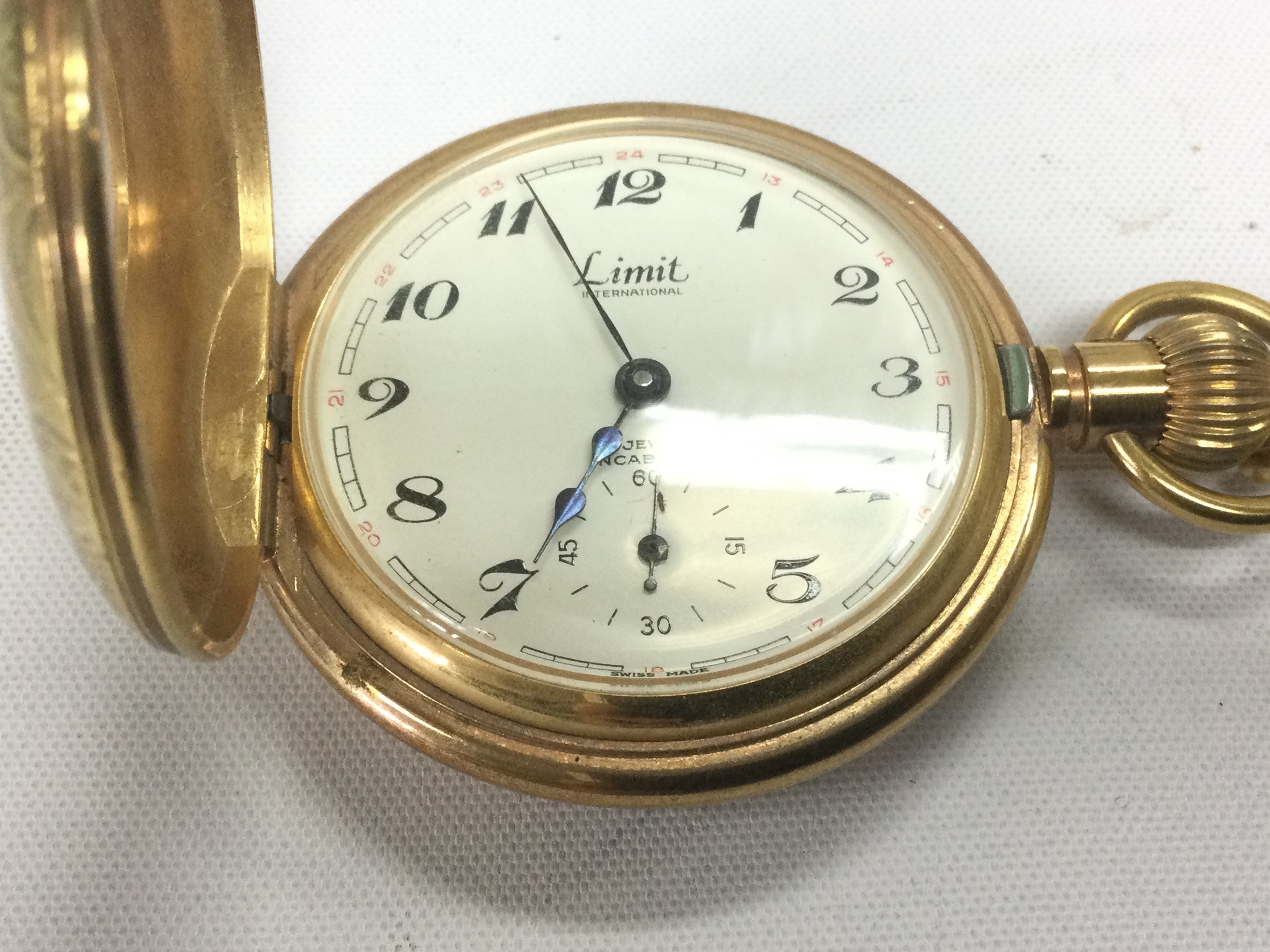 WITHDRAWN - A yellow metal half hunter fob watch and chain. Shipping category A.- NO RESERVE