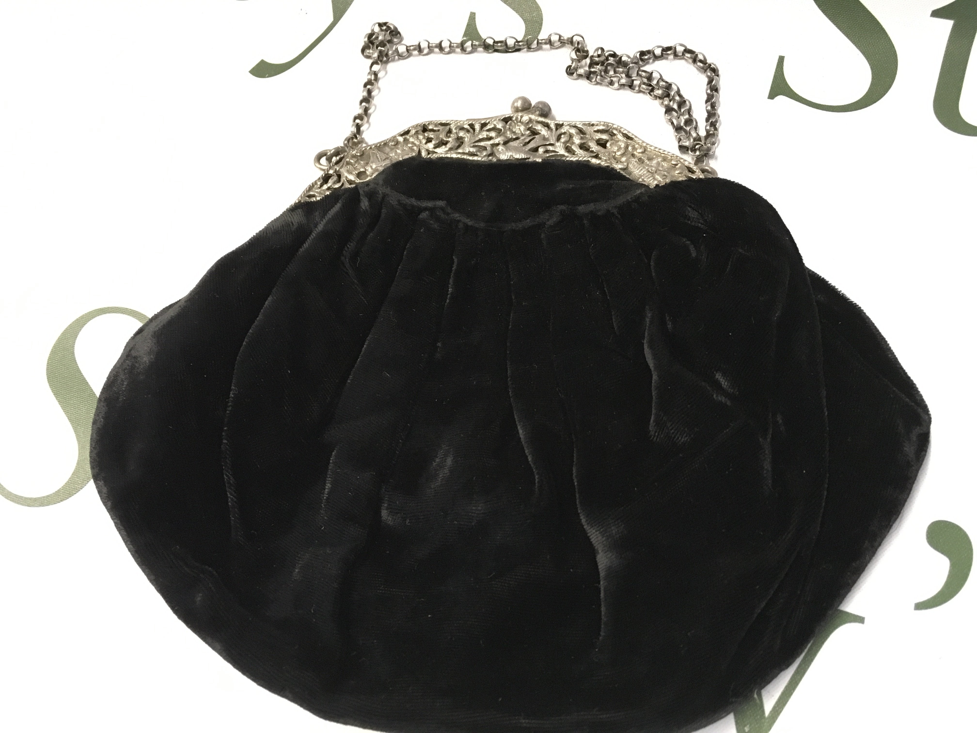 A vintage black velvet and silver evening bag . Postage category B