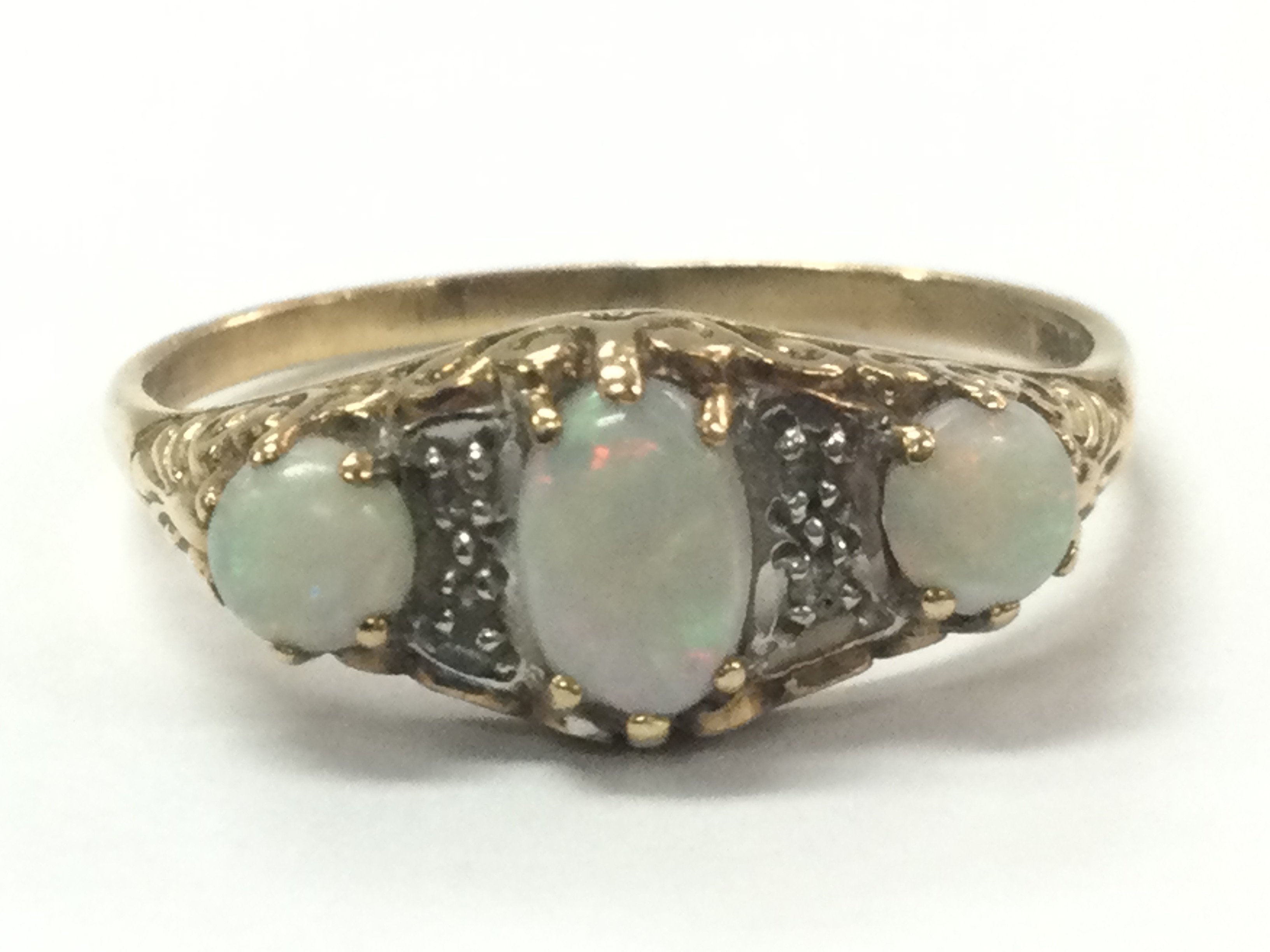 A three stone opal set ring , 1.99g total weight. Size S Postage category A