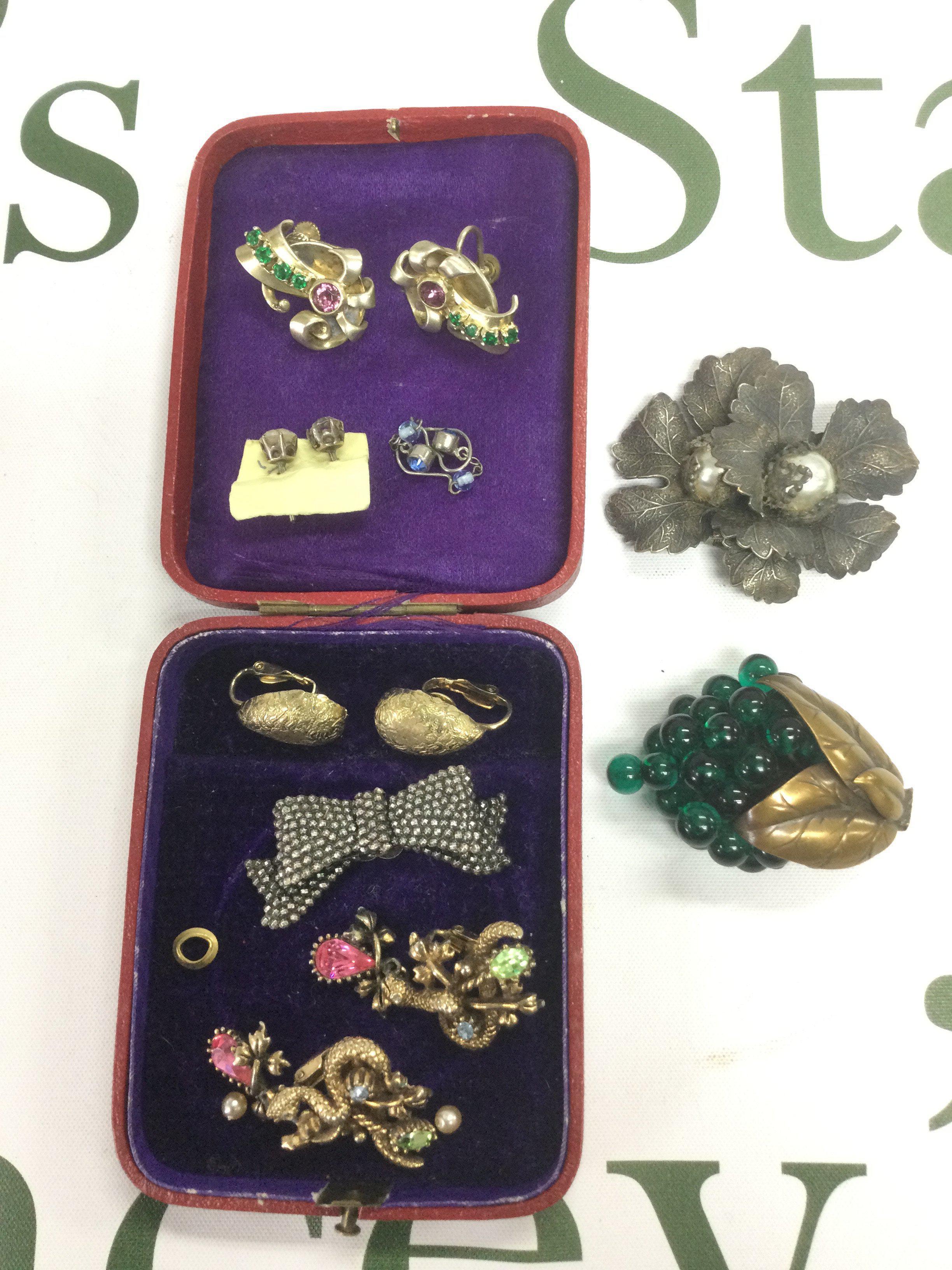 A small collection of jewellery comprising an American designer brooch by Coro, a pair of earrings etc. Shipping category A.