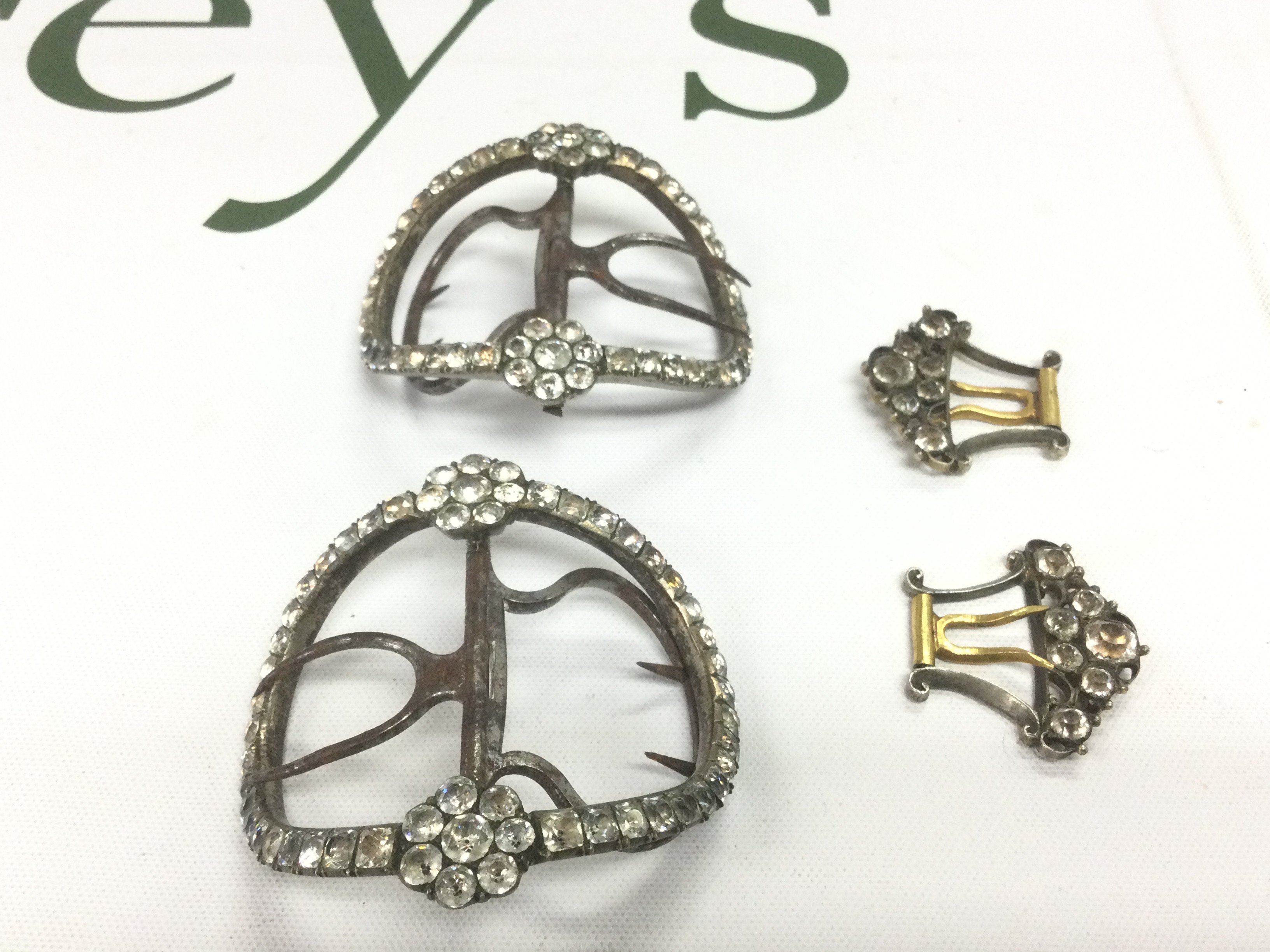 Four antique buckles. Shipping category A.
