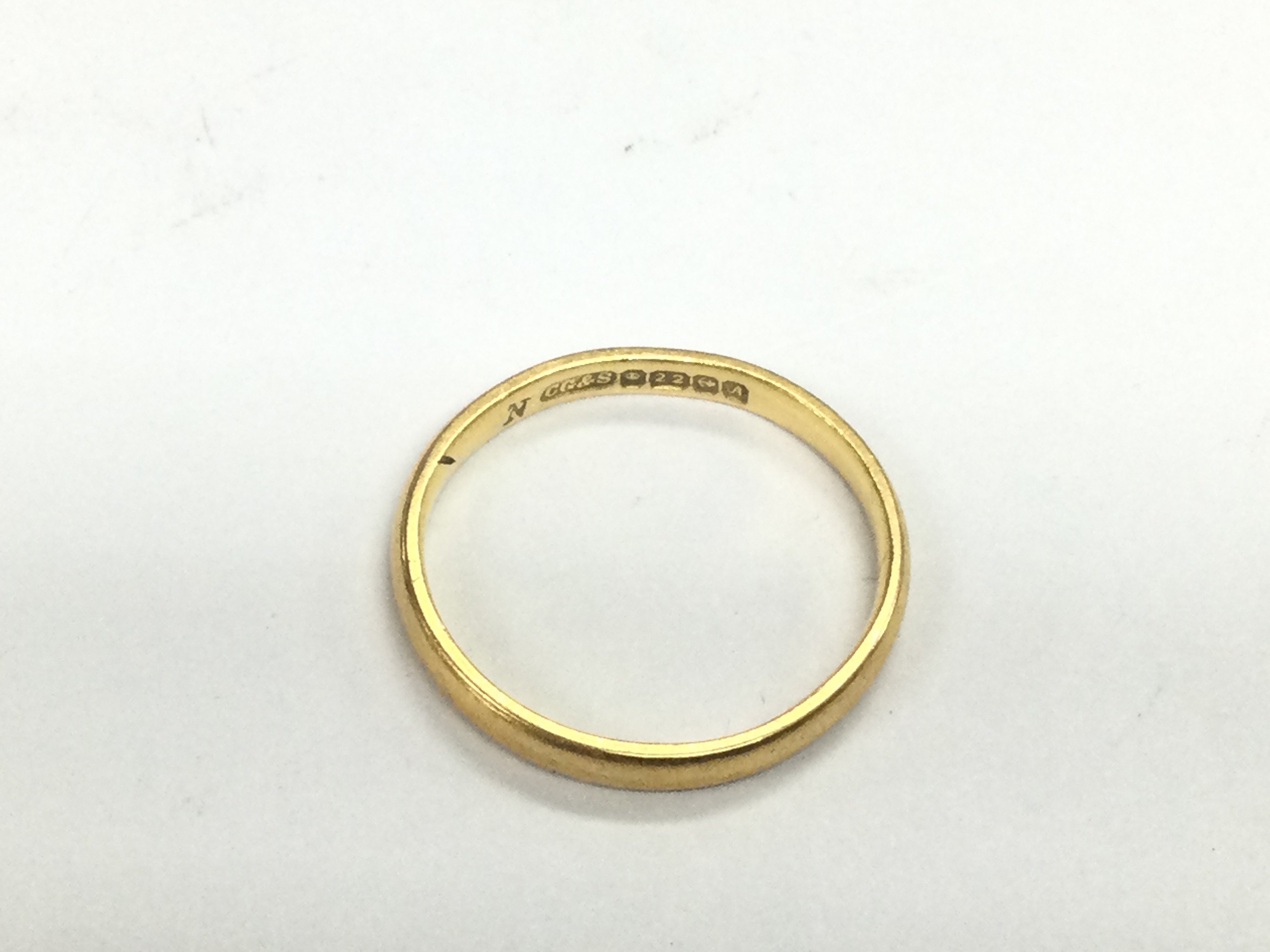 A 22ct gold wedding band, approx 2.2g and approx size K. Shipping category A.