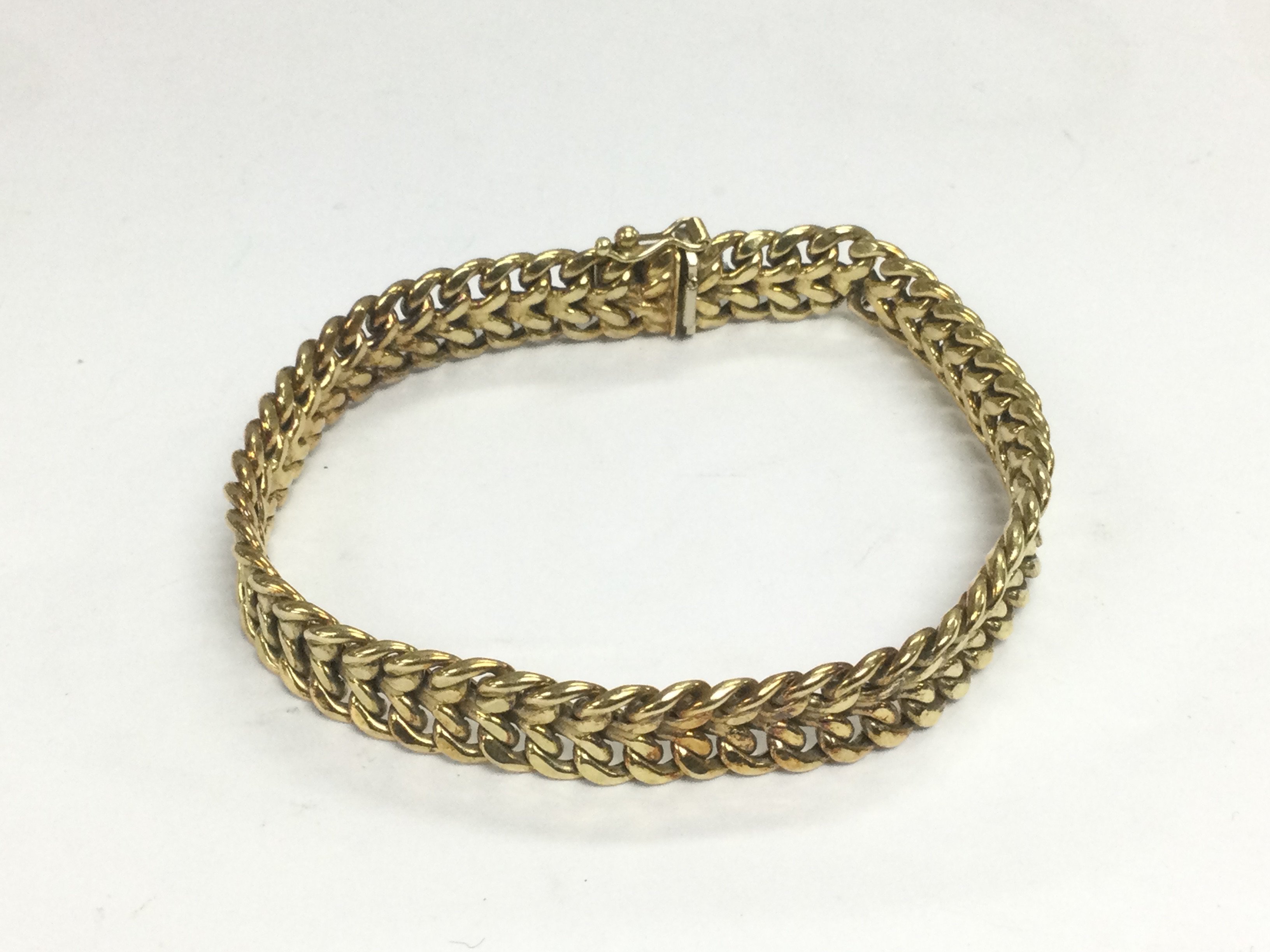 A 14k gold bangle, approx 12.7g. Shipping category A.