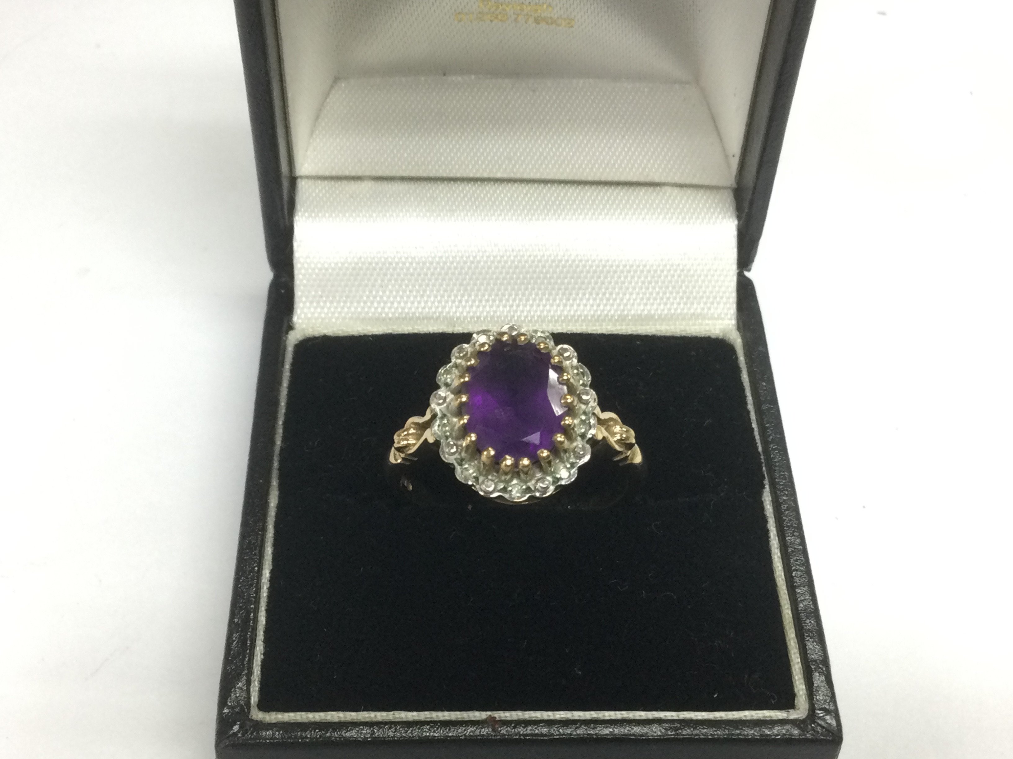 A 9ct gold ring set with a central amethyst, approx 4.2g and approx size Q. Shipping category A.
