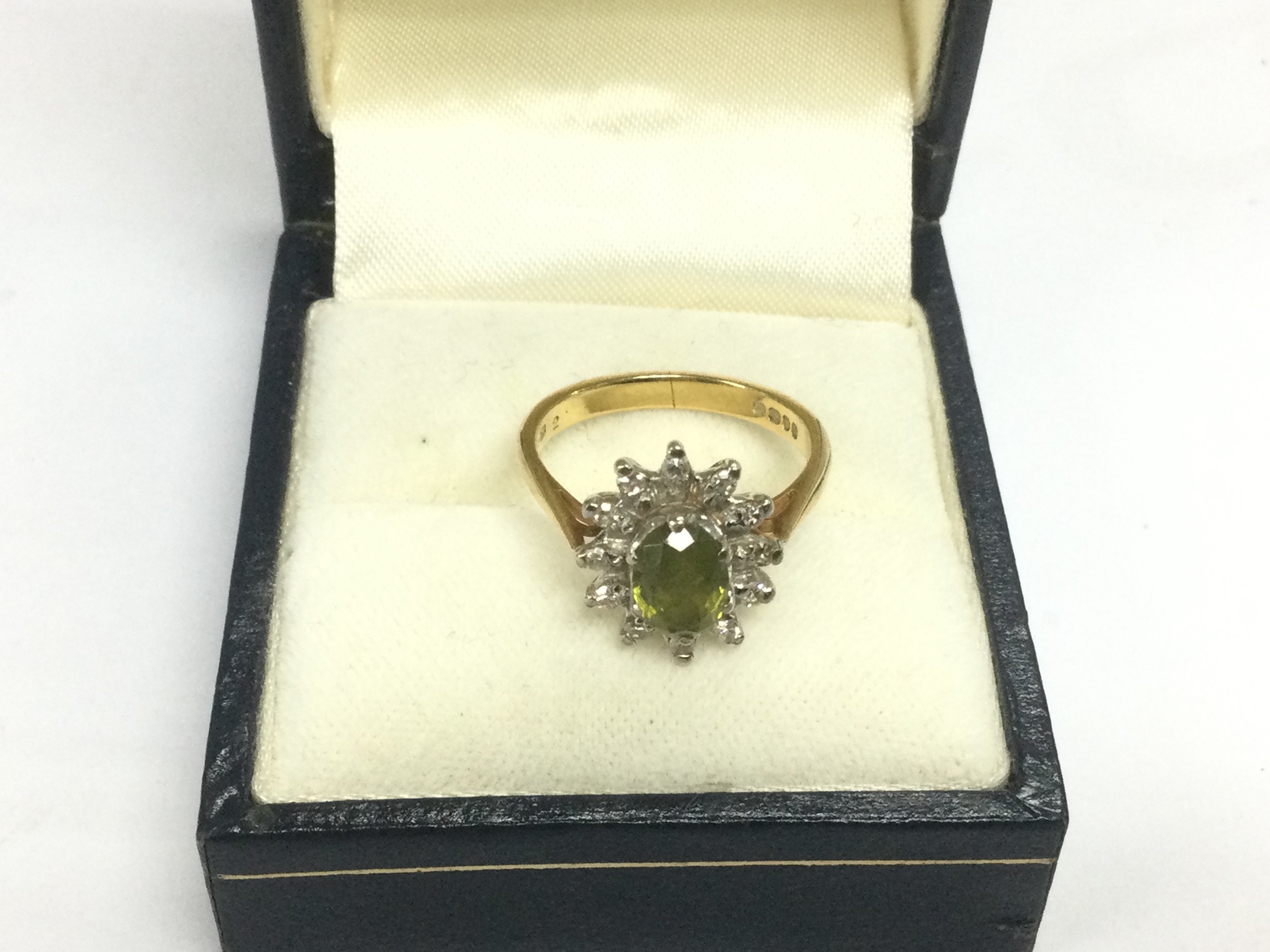 An 18ct gold ring set with green tourmaline, approx 4g and approx size J. Shipping category A.