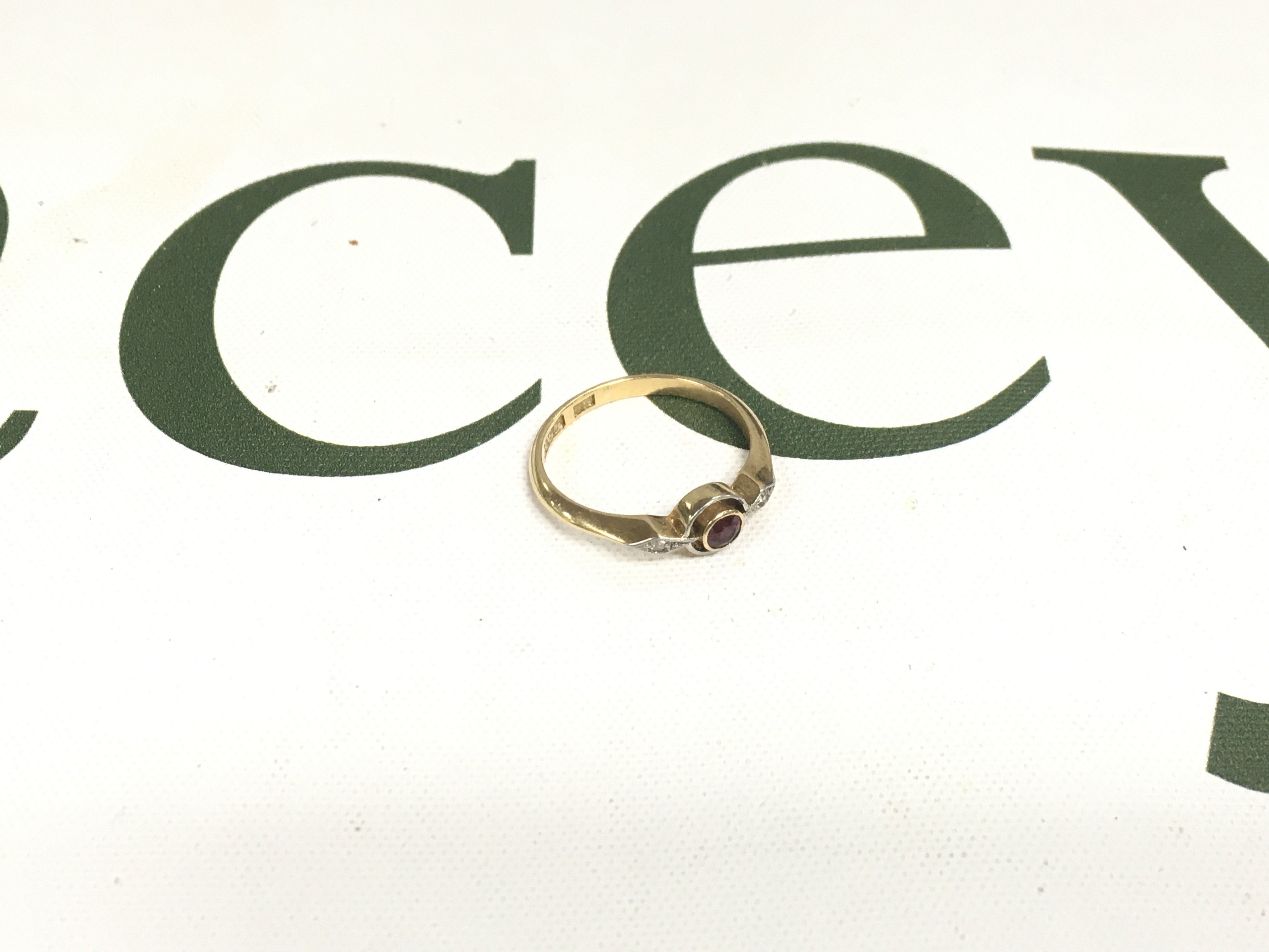 An 18ct ruby and diamond ring. Approx weight 2.08 grams, approx size K.