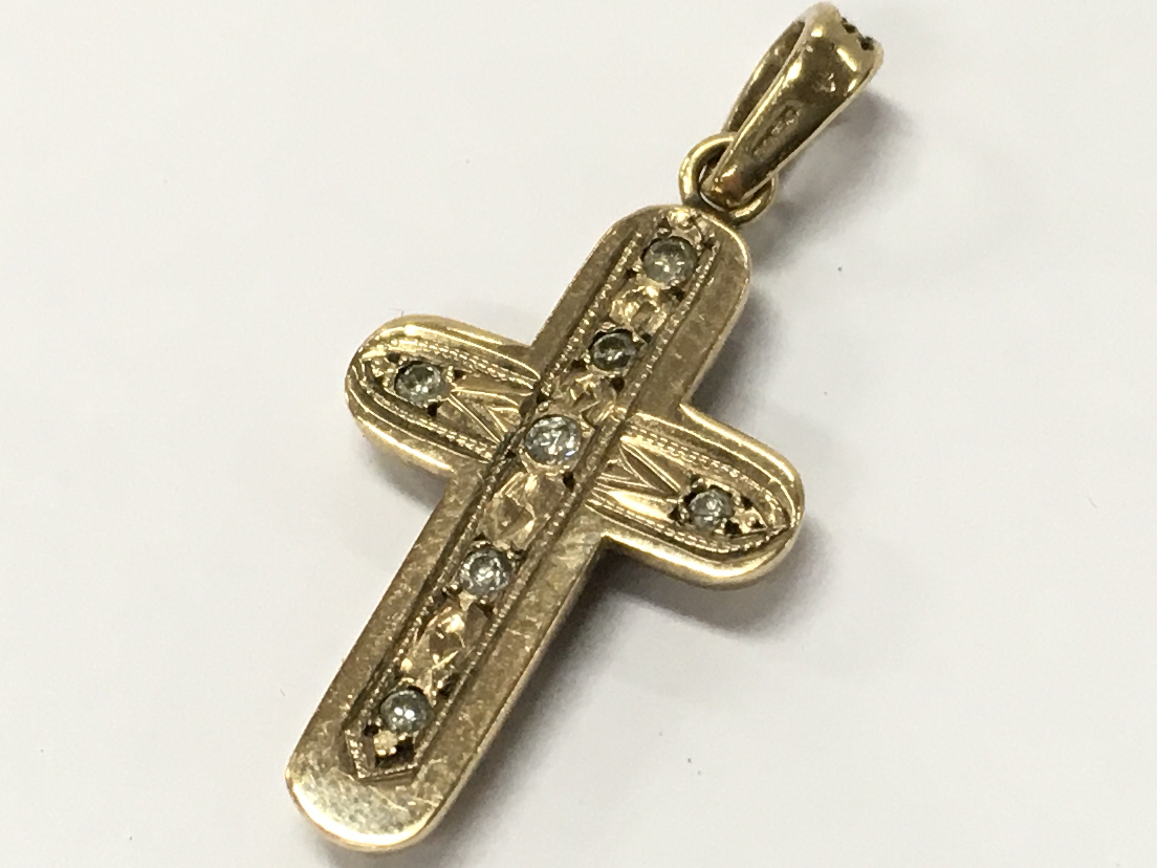 A gold pendant set with rubies and diamonds . 3.5g total weight. Postage category A