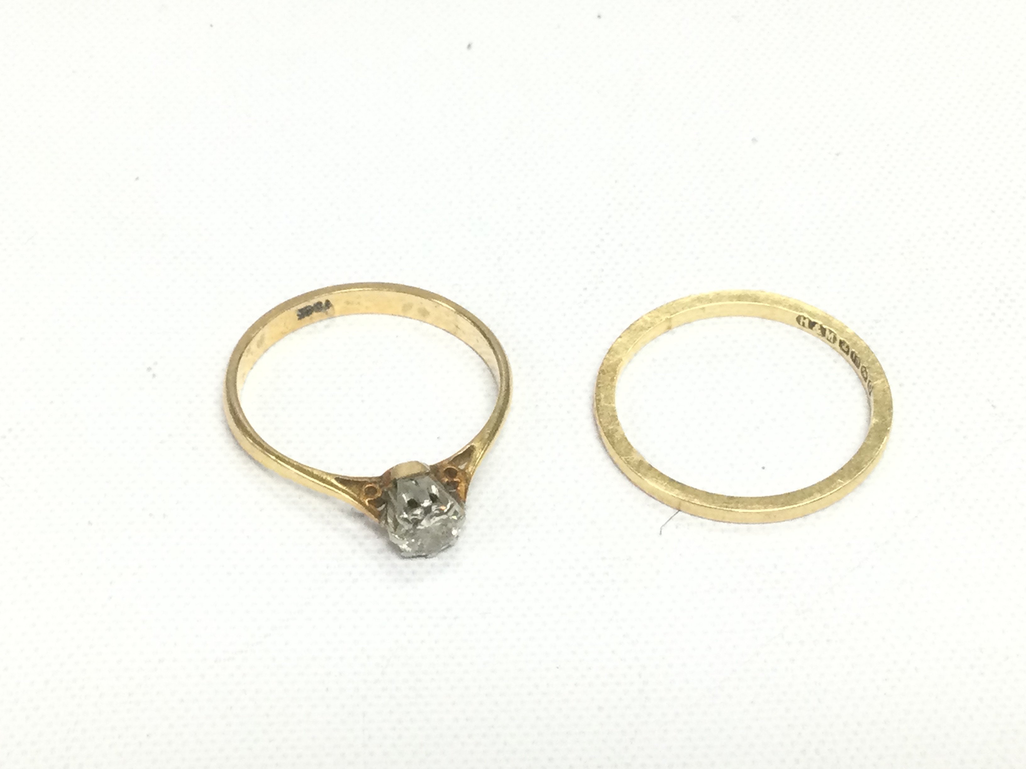 An 18ct gold 0.15ct diamond solitaire ring and an 18ct gold wedding band (2). Approx total weight 3.2g and approx sizes K-L. Shipping category A.