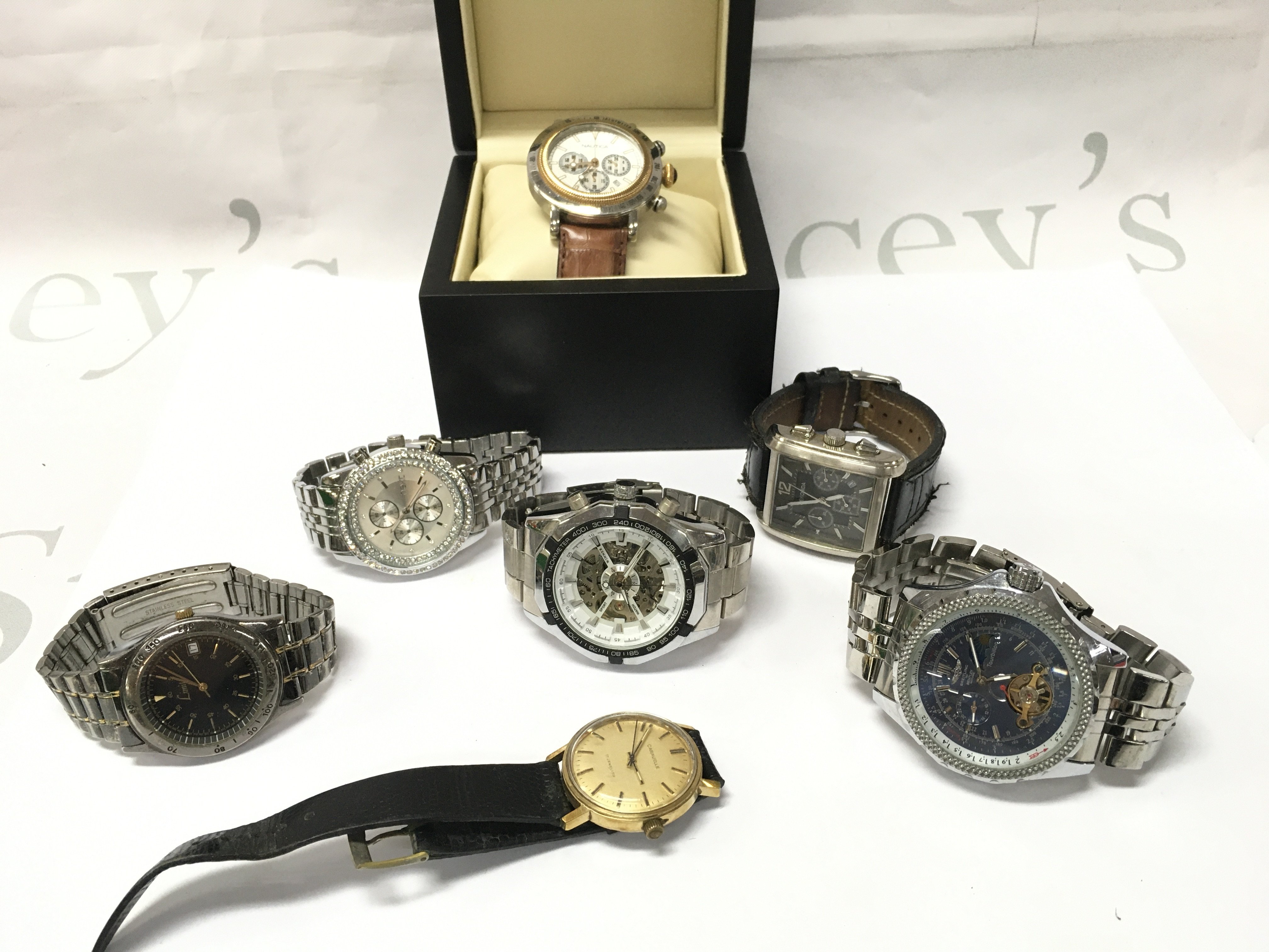 A collection of Gents watches Nautica, Caravelle, Limit. Postage category B