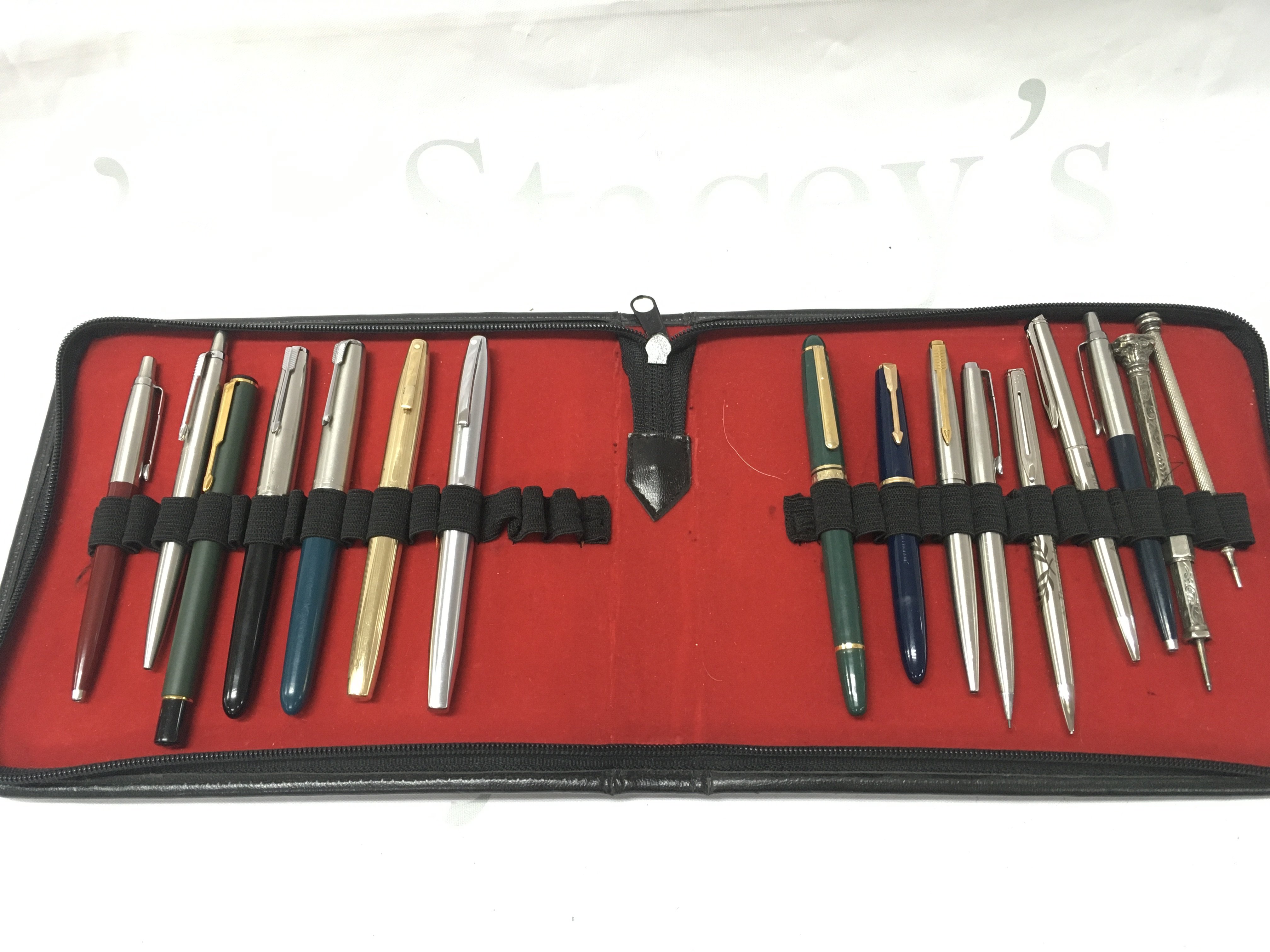 A collection of various fountain pens including two Parker 51s 14ct nibs, two Sheaffer white dots, Watermans etc. postage category B