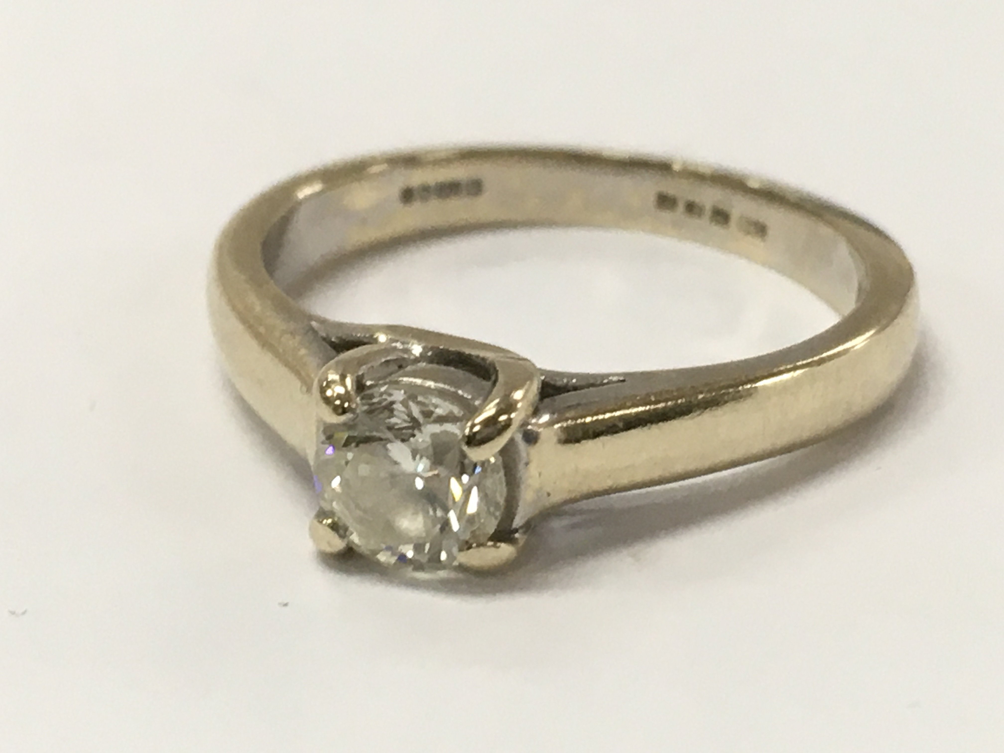 An 18ct gold diamond ring , size L/M. 3.7g total weight. Postage catA