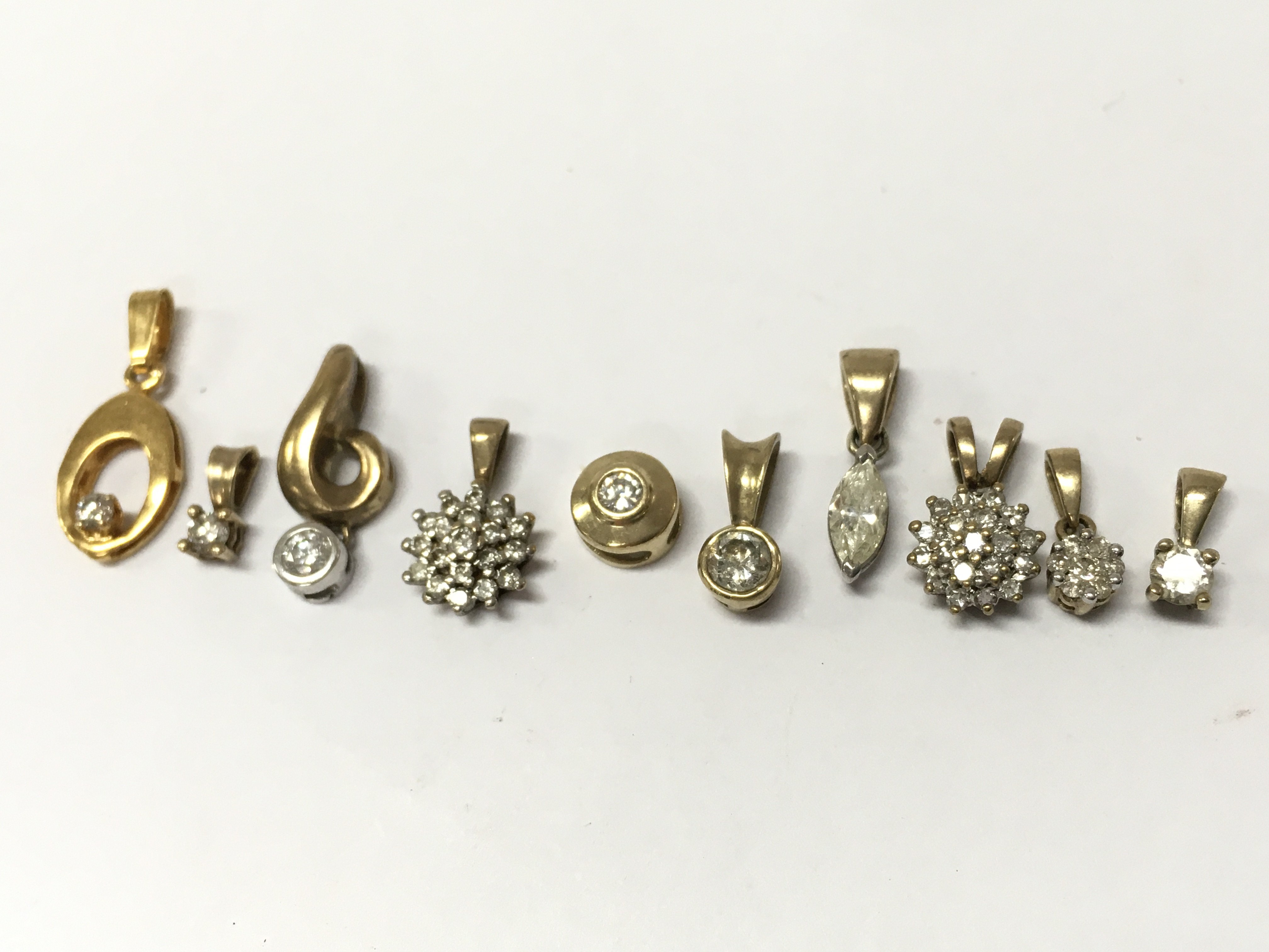 9ct gold and diamond stone set pendants , 6.2g total weight. Postage category A