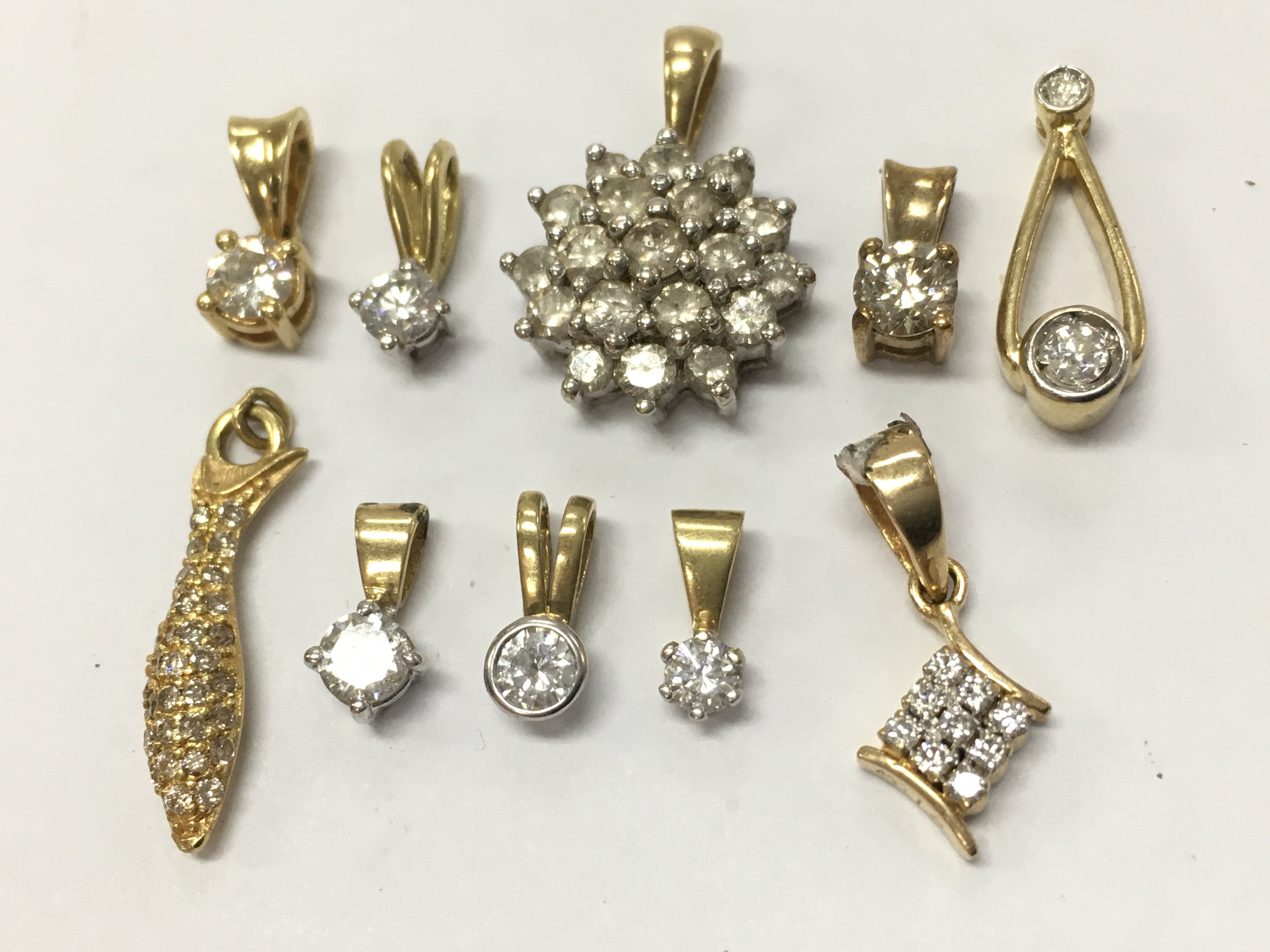 18ct gold assorted diamond pendants , 10g total weight. Postage category A