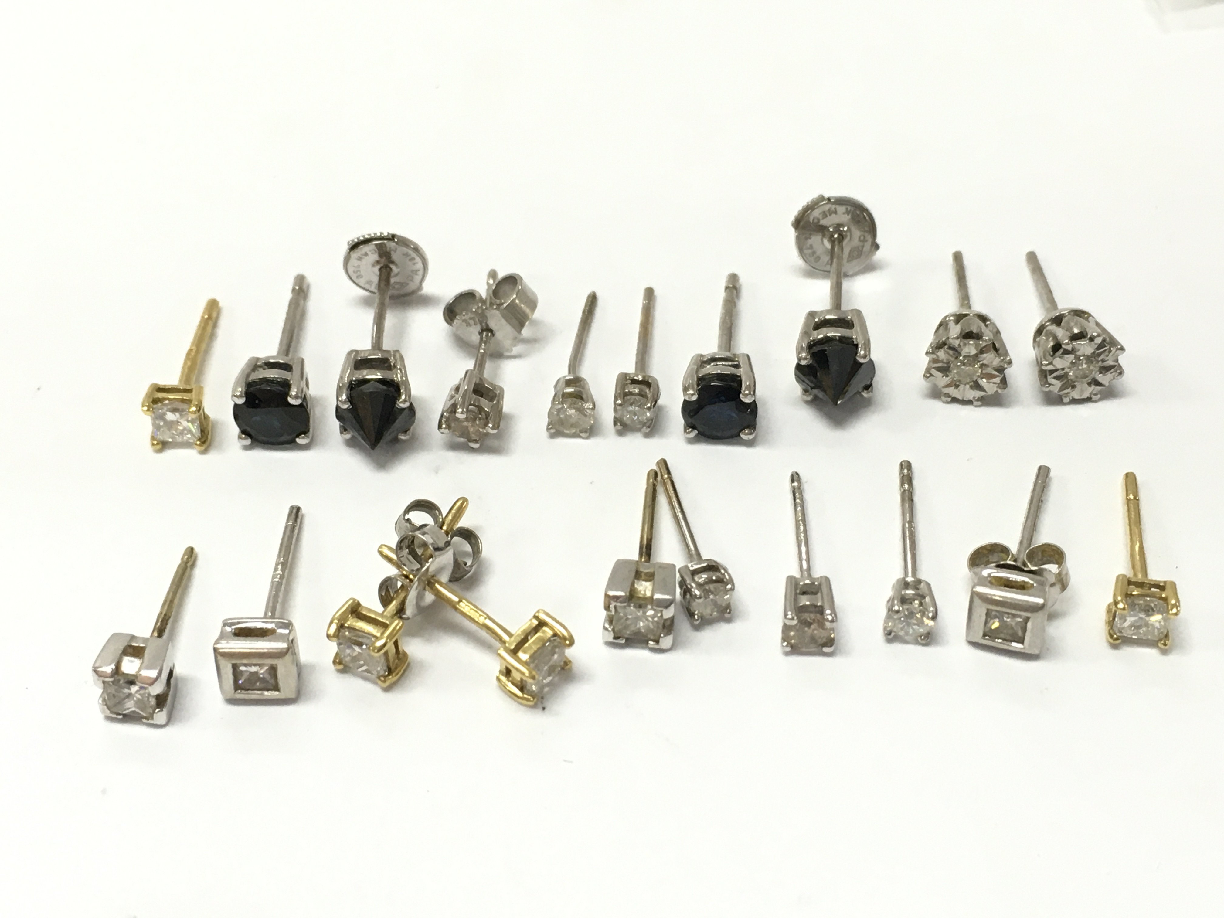 18ct white gold diamond and sapphire stone set stud earrings. 10.8g total weight Postage category A