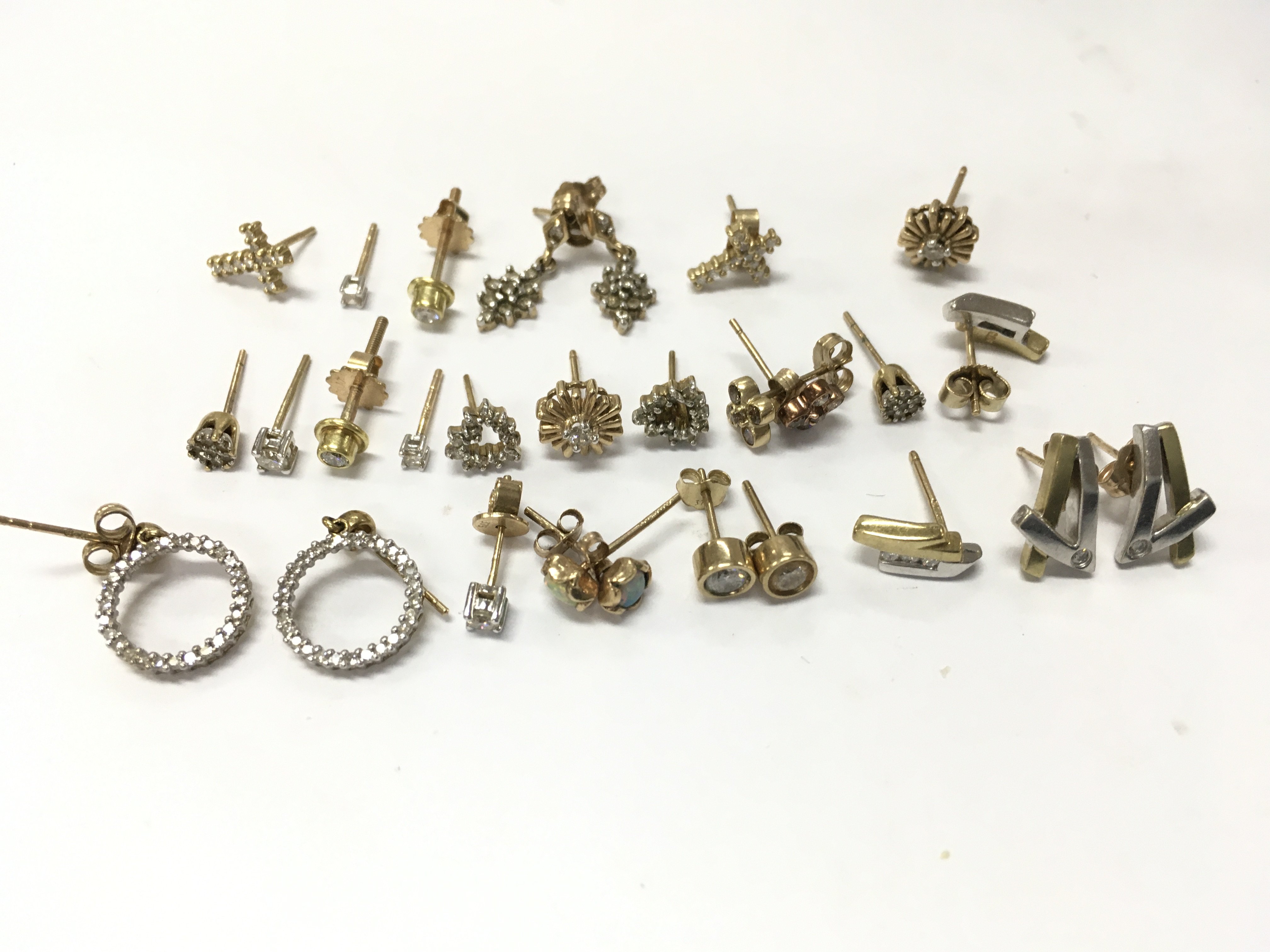 9ct gold diamond set earrings , 16.4g total weight . Postage category A