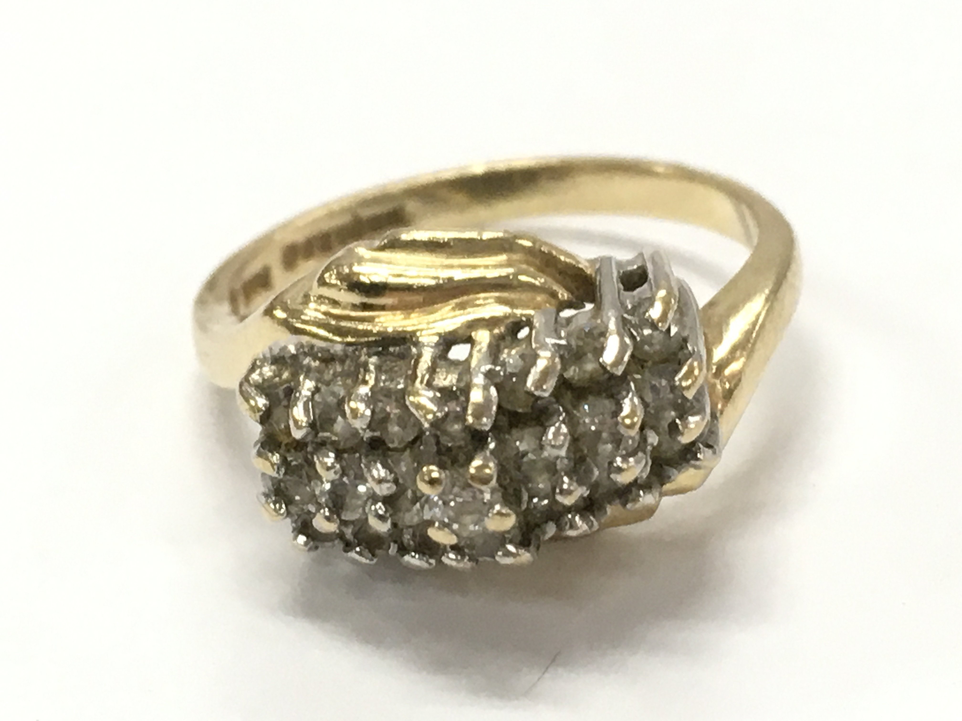 A 14ct gold diamond cluster ring , 4g total weight. Size M. Postage catA