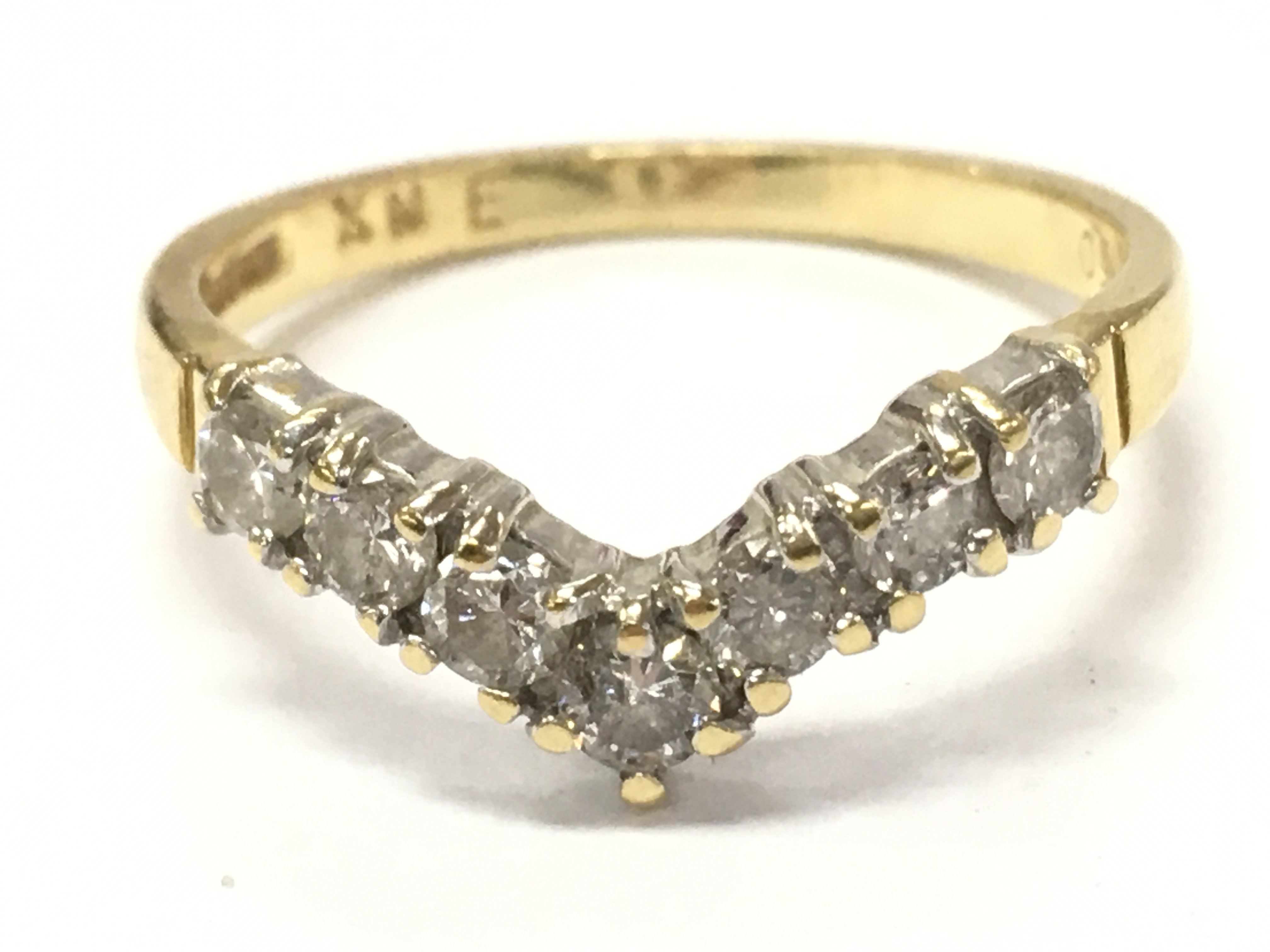 An 18ct gold diamond wishbone ring size N/O 2.9g total weight 2.9g. Postage category A