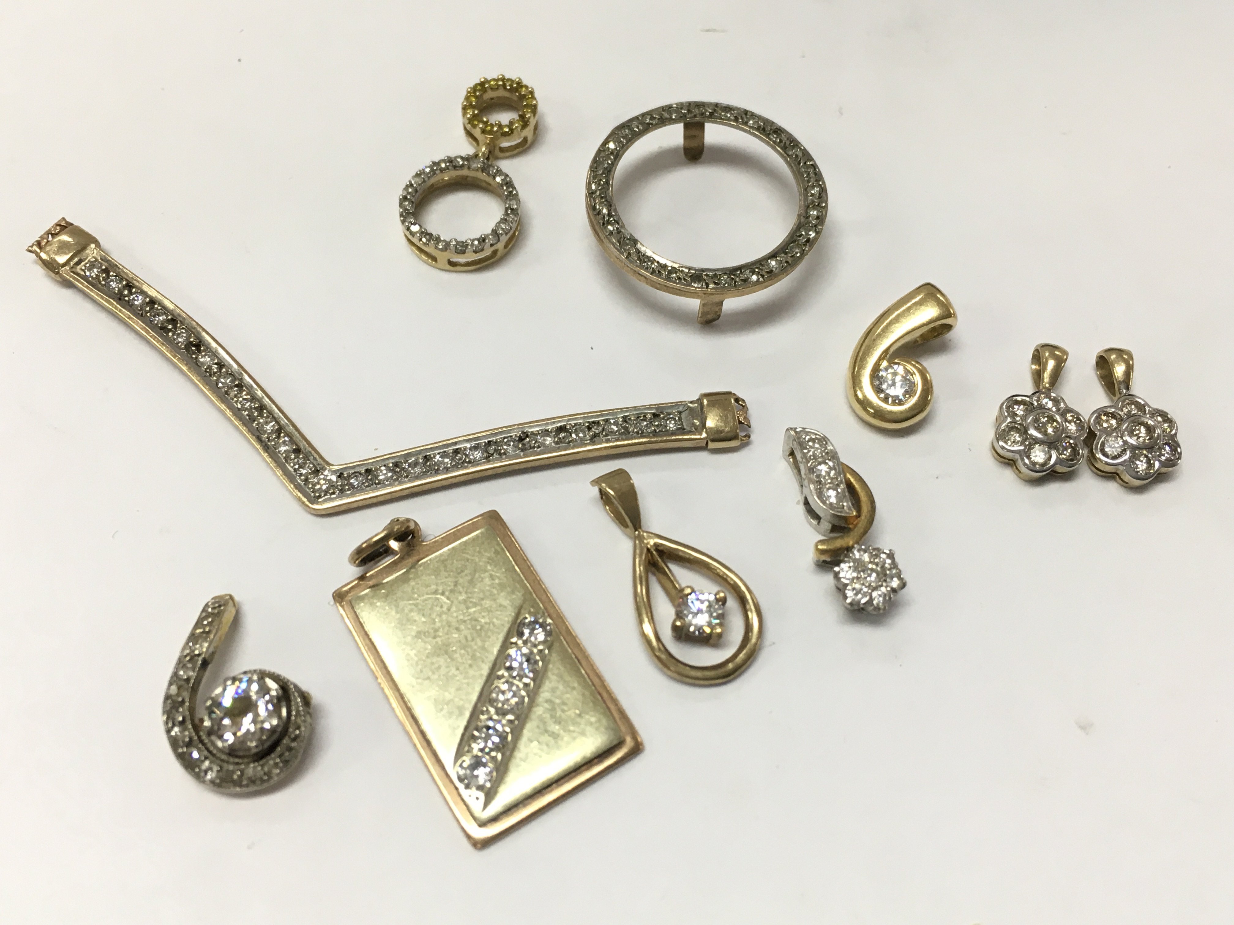 9ct gold diamond set pendants , 15.2g total weight. Postage category A