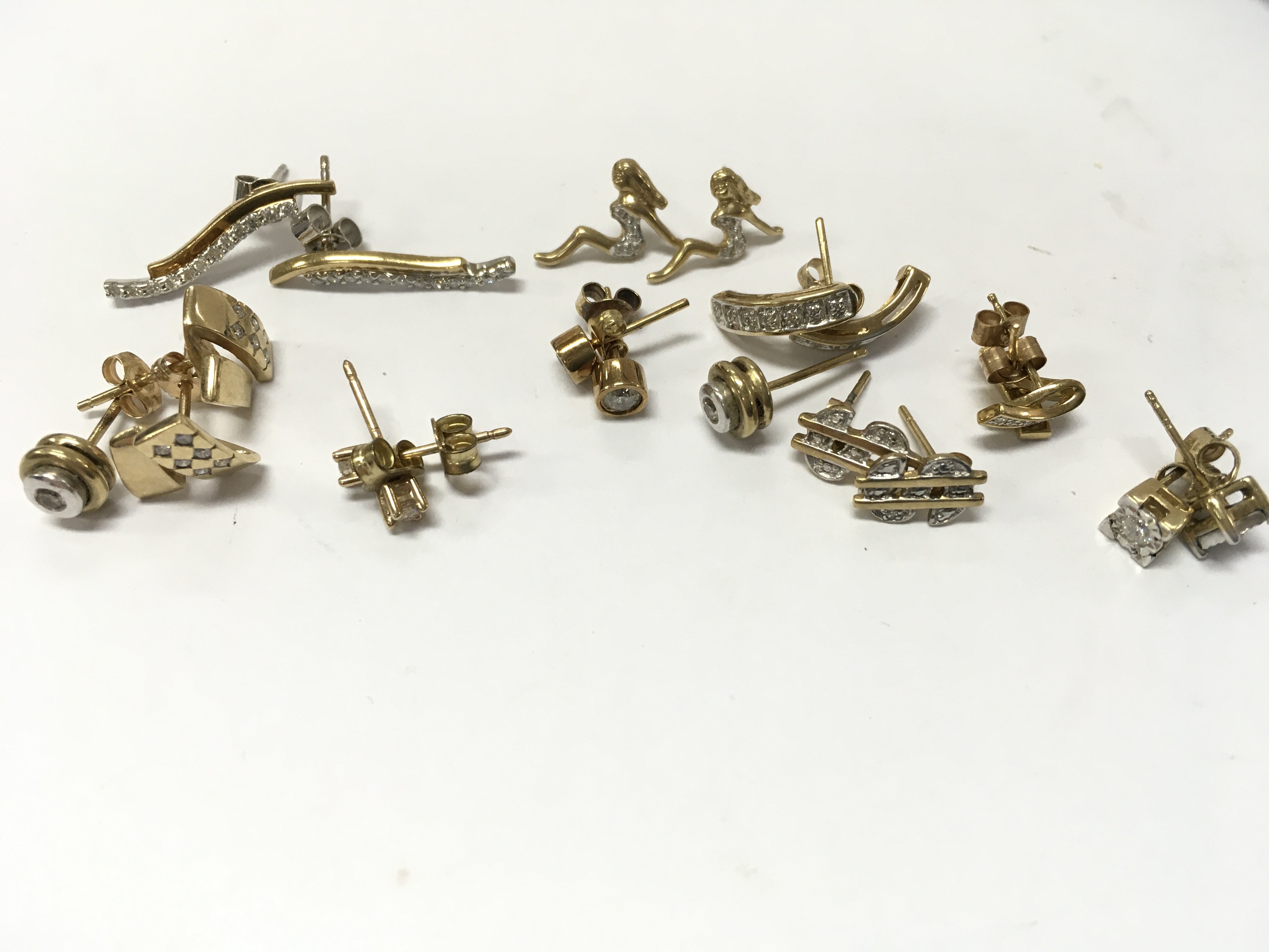 9ct gold assorted diamond stud earrings. 13g total weight. Postage category A