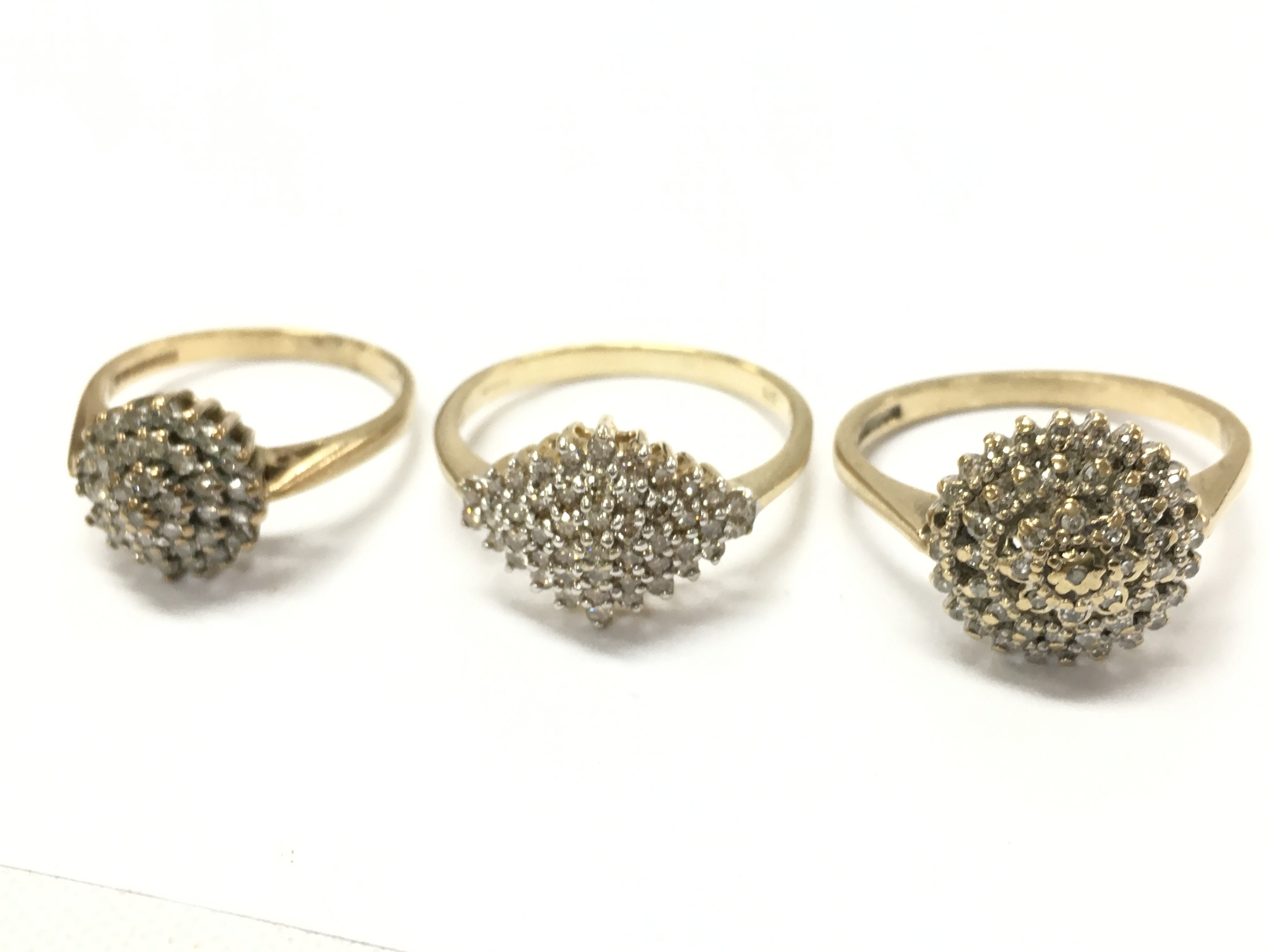 9ct gold diamond cluster rings , 7.3G total weight. Postage cat a