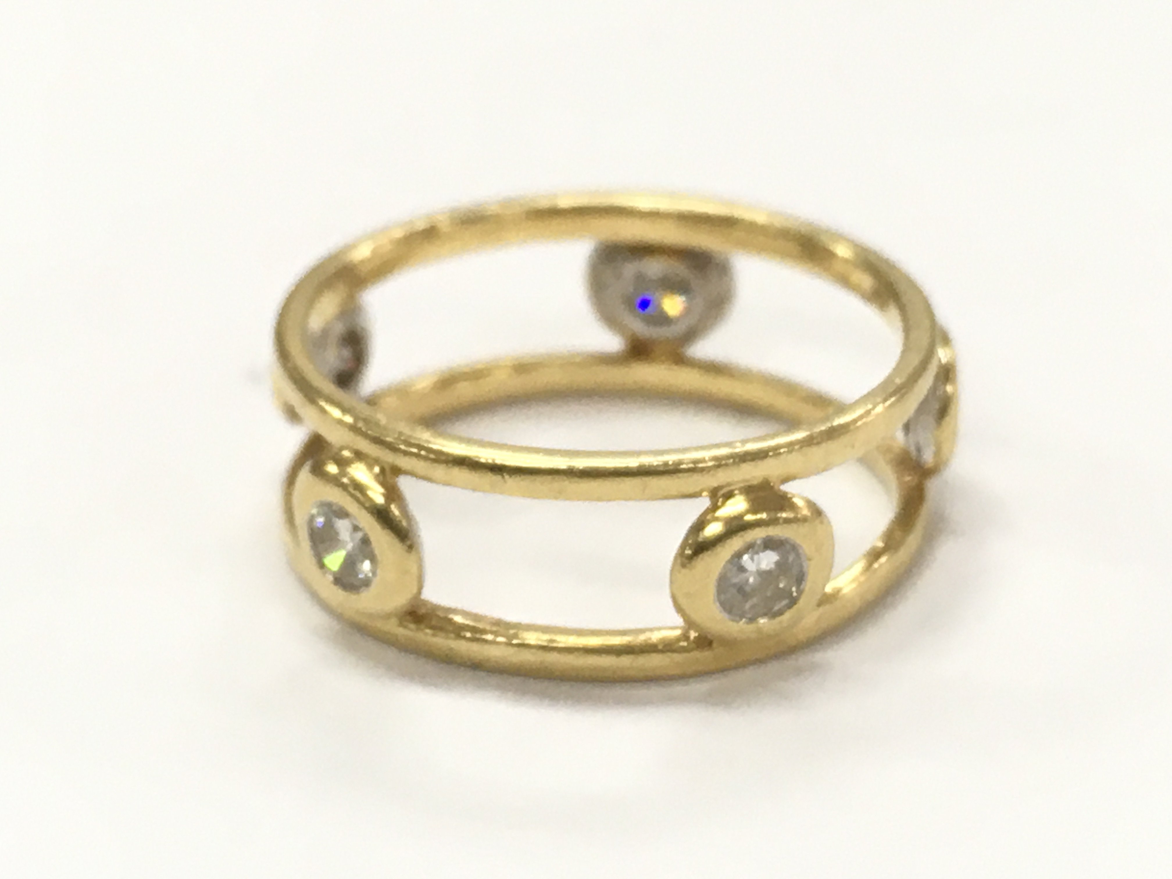 An unmarked 14ct gold band ring, total weight 2.7g . Postage category A