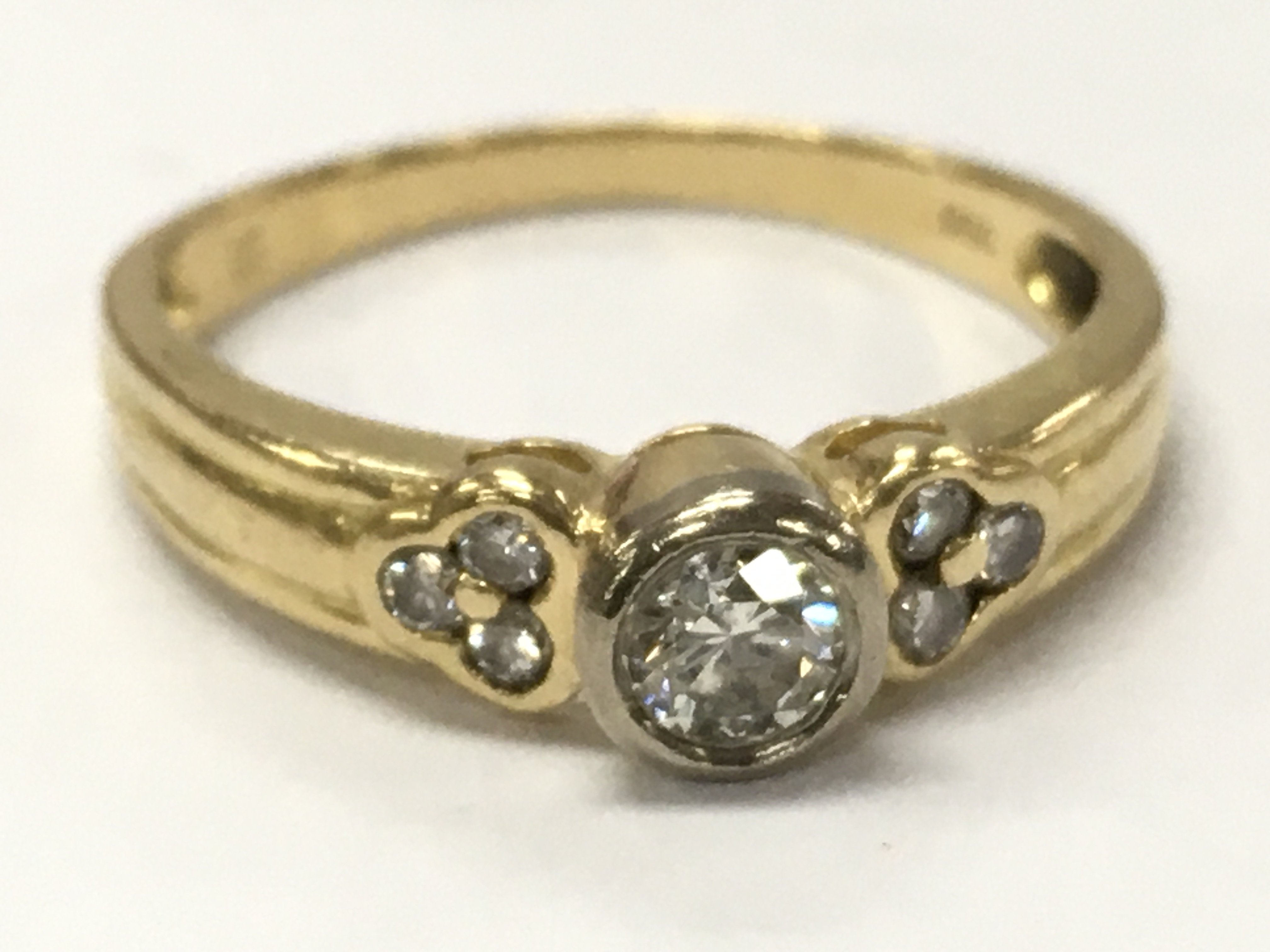 18ct gold diamond solitaire ring with diamond shoulders , 2.5g total weight. Postage category A
