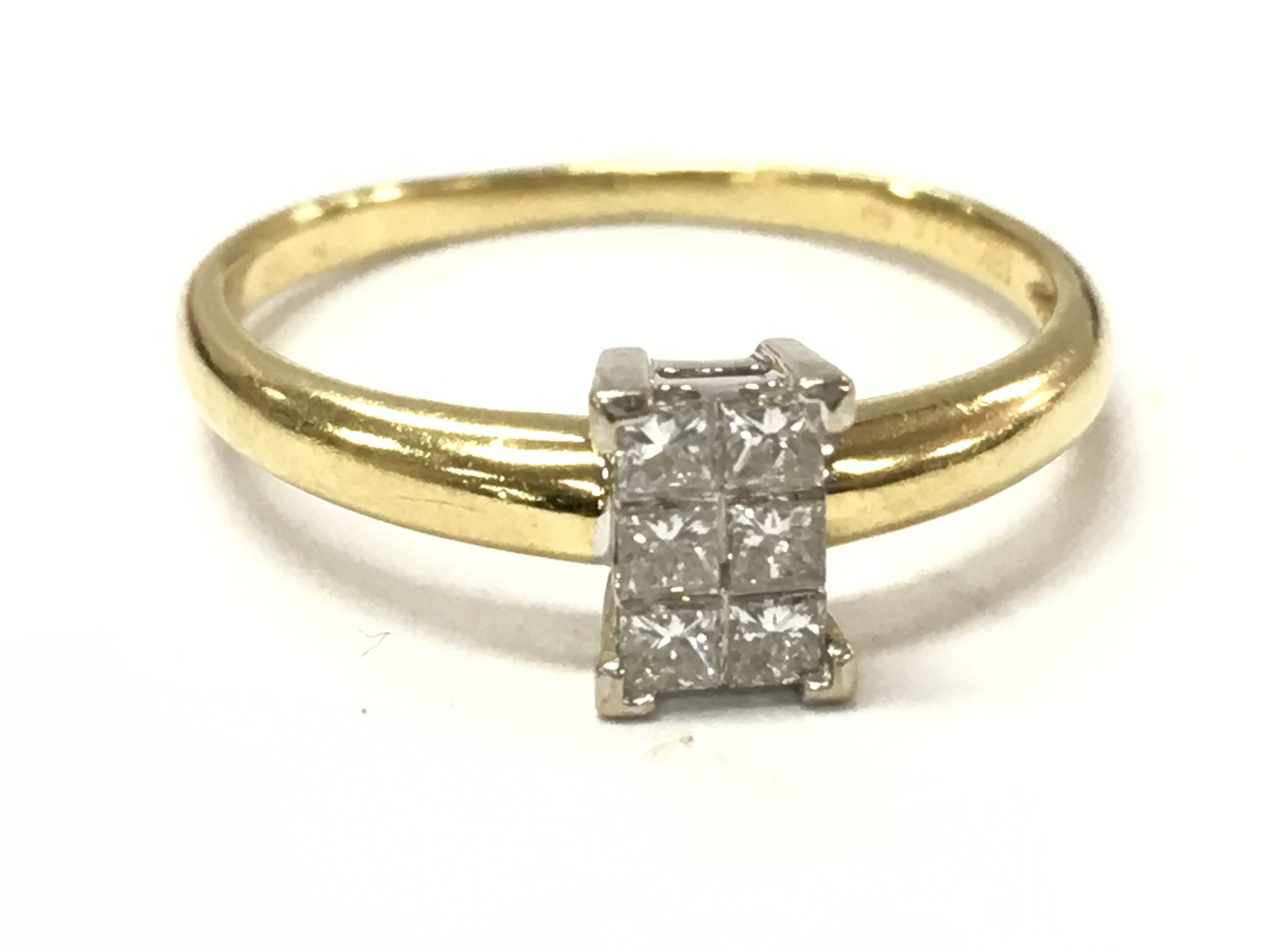 An 18ct gold 6x princess cut diamond cluster ring, N/O. 2.5g Postage category A