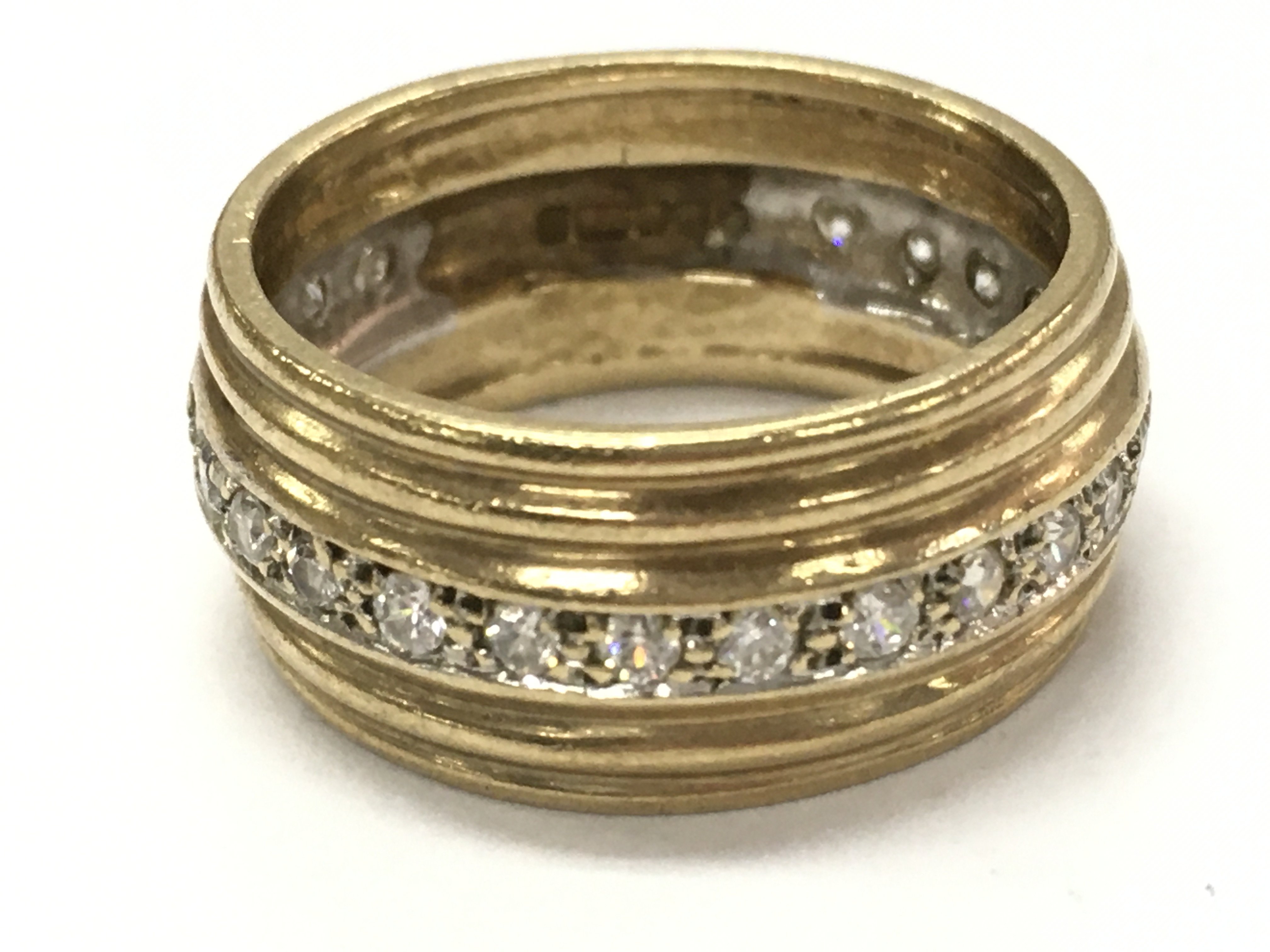 A 9ct gold diamond band ring, size N. 5.3g total weight. postage cat a