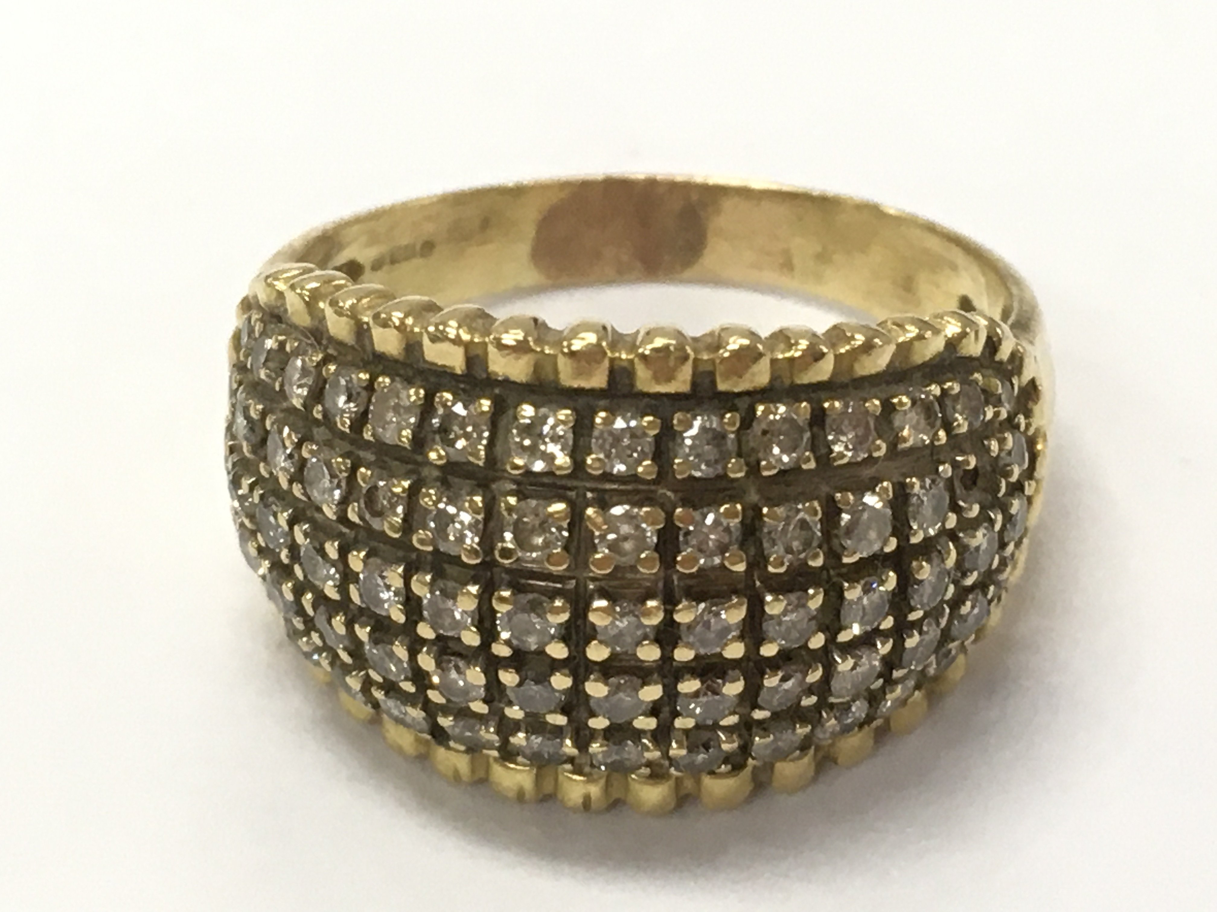 An 18ct gold diamond cluster ring , 8g total weight. Size S. Postage category A