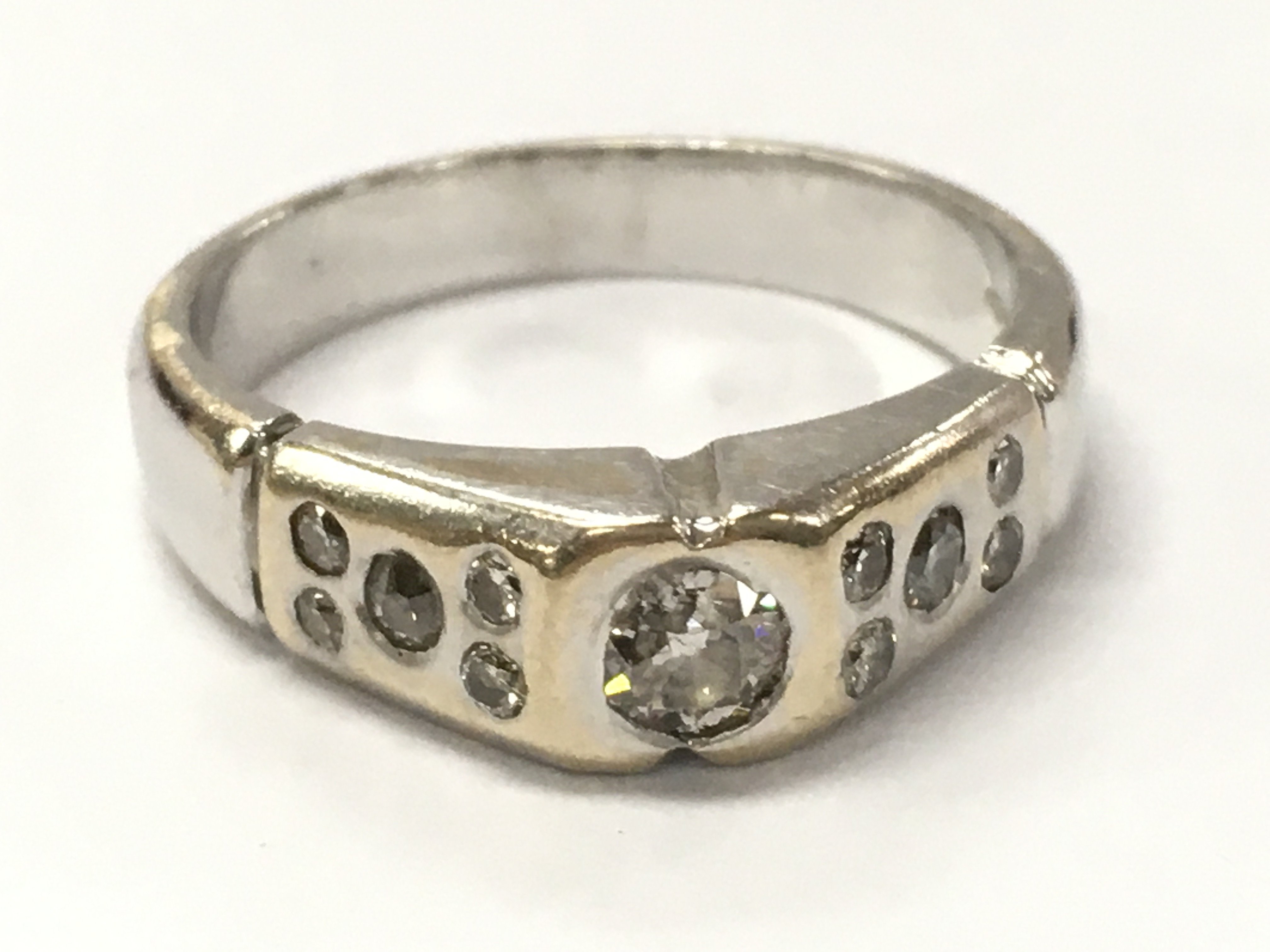 An 18ct white gold diamond solitaire with diamond shoulders , size L, 5g