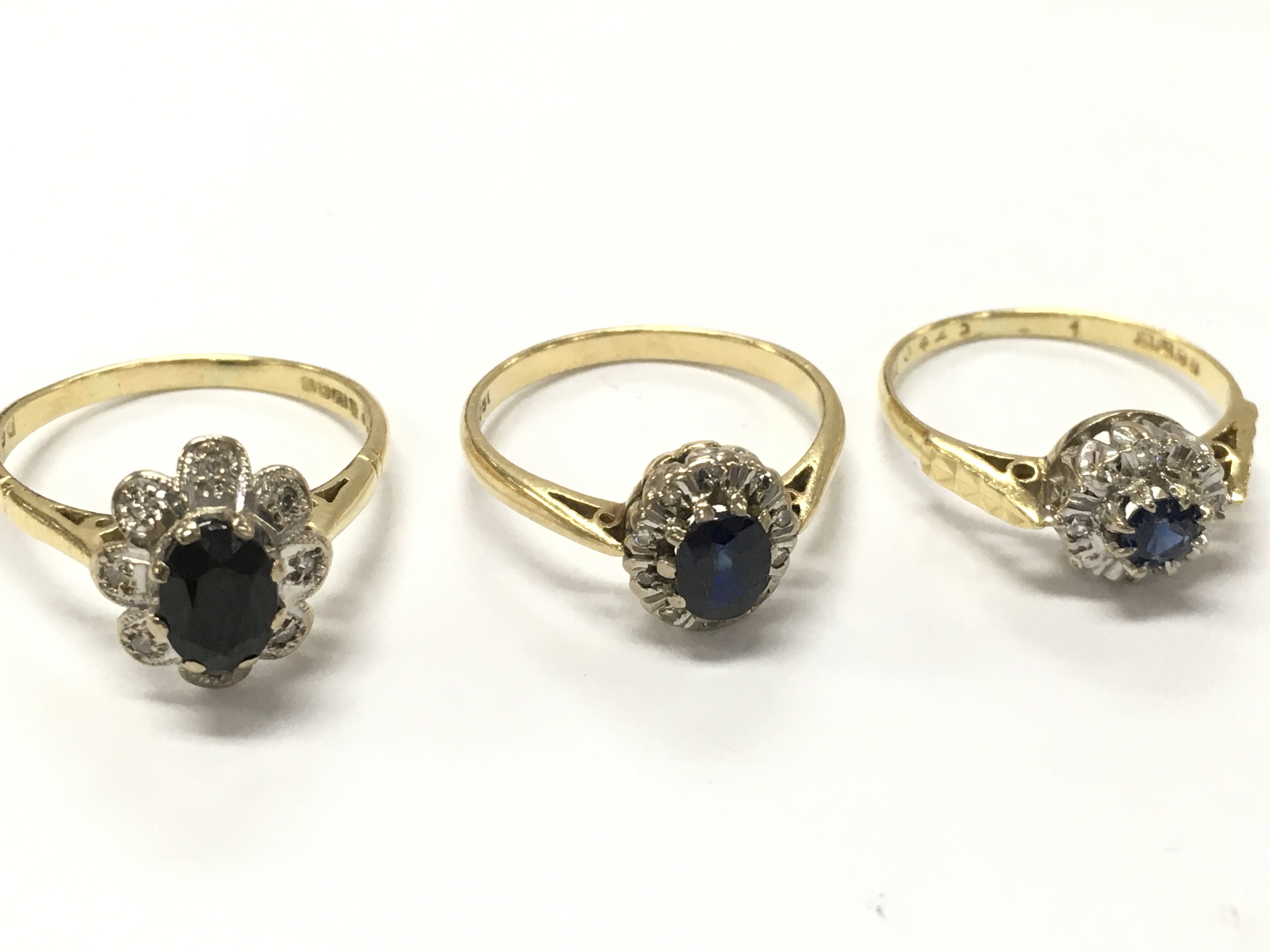 18ct gold sapphire and Diamond Cluster rings , 8.9g total weight. Postage category A