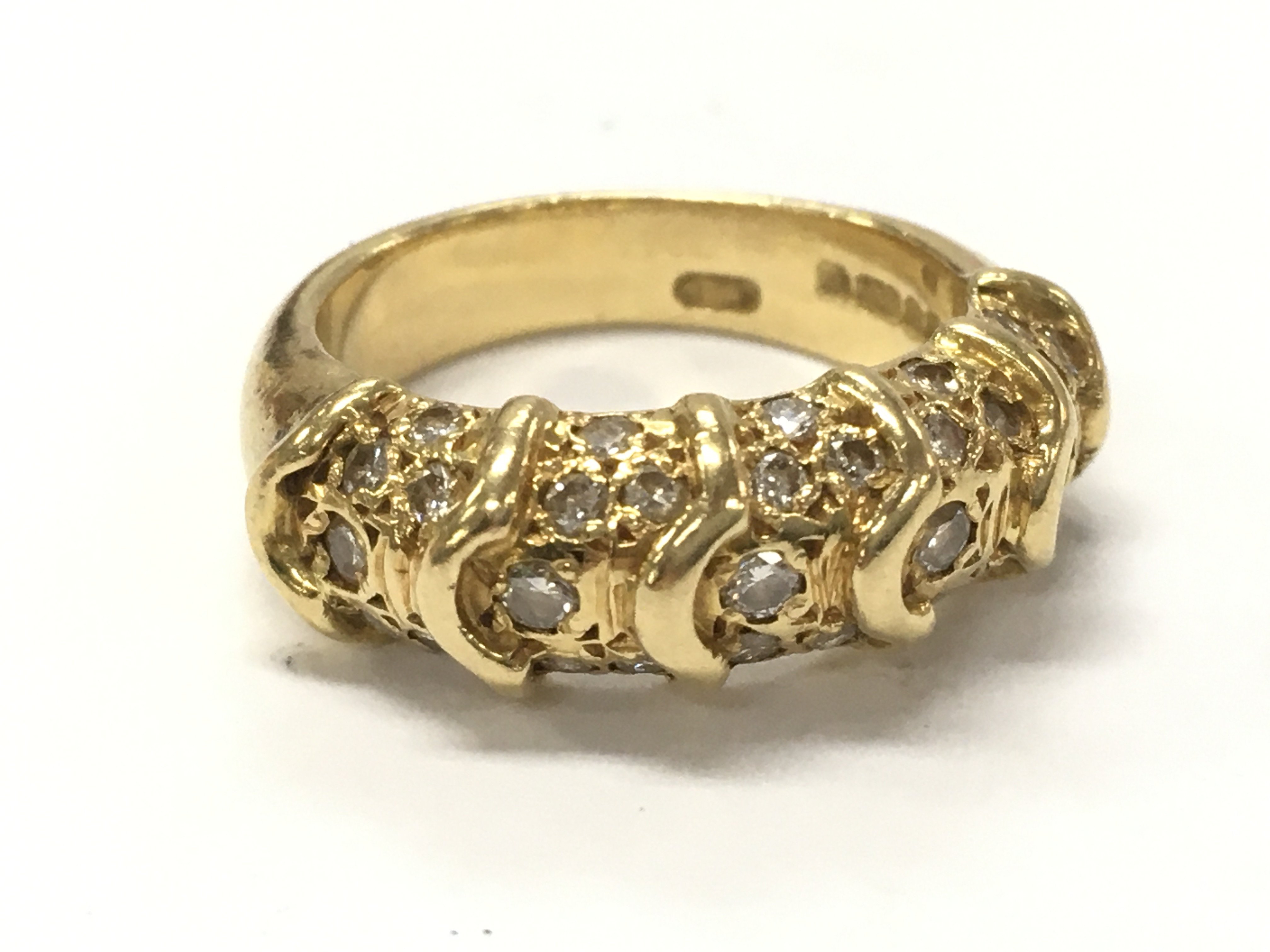 An 18ct gold ring, size J. 7.8g total weight. Postage category A