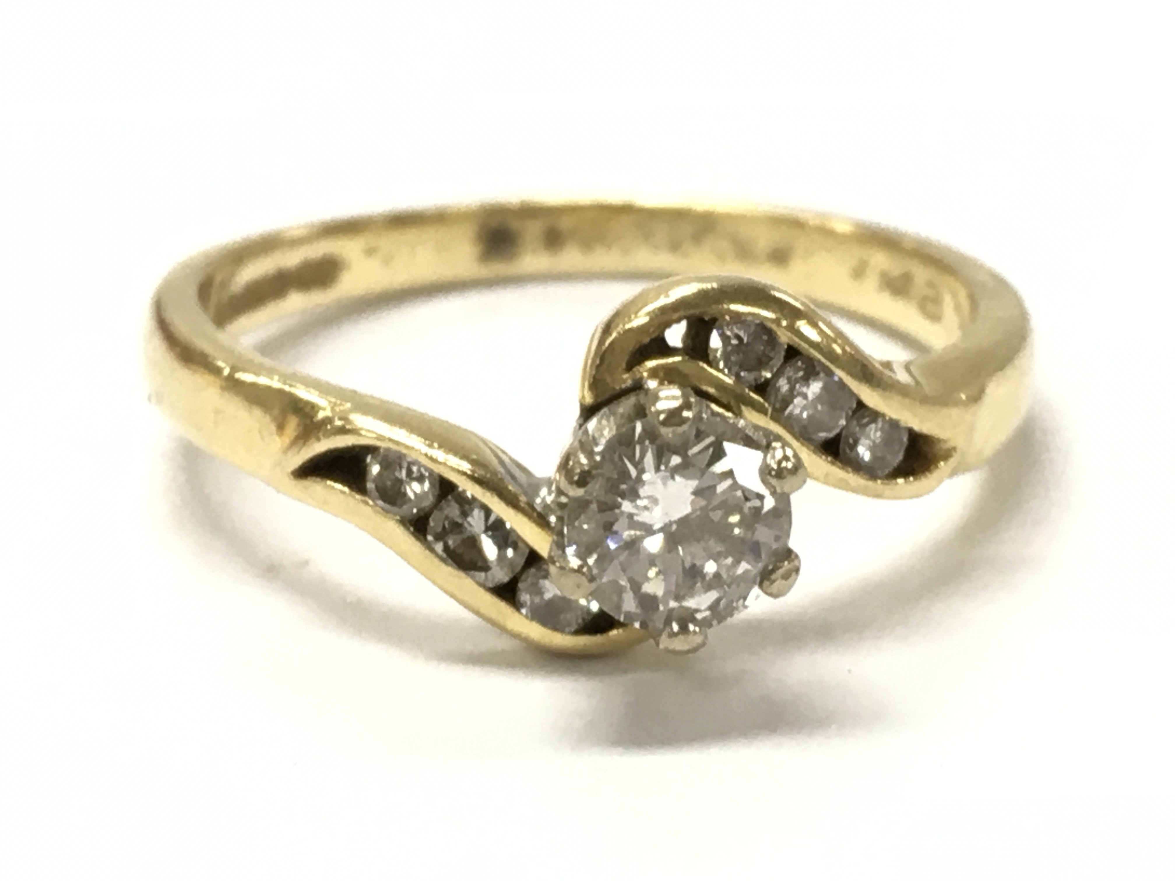 18ct gold diamond twist ring size O, 3g total weight . Postage category A