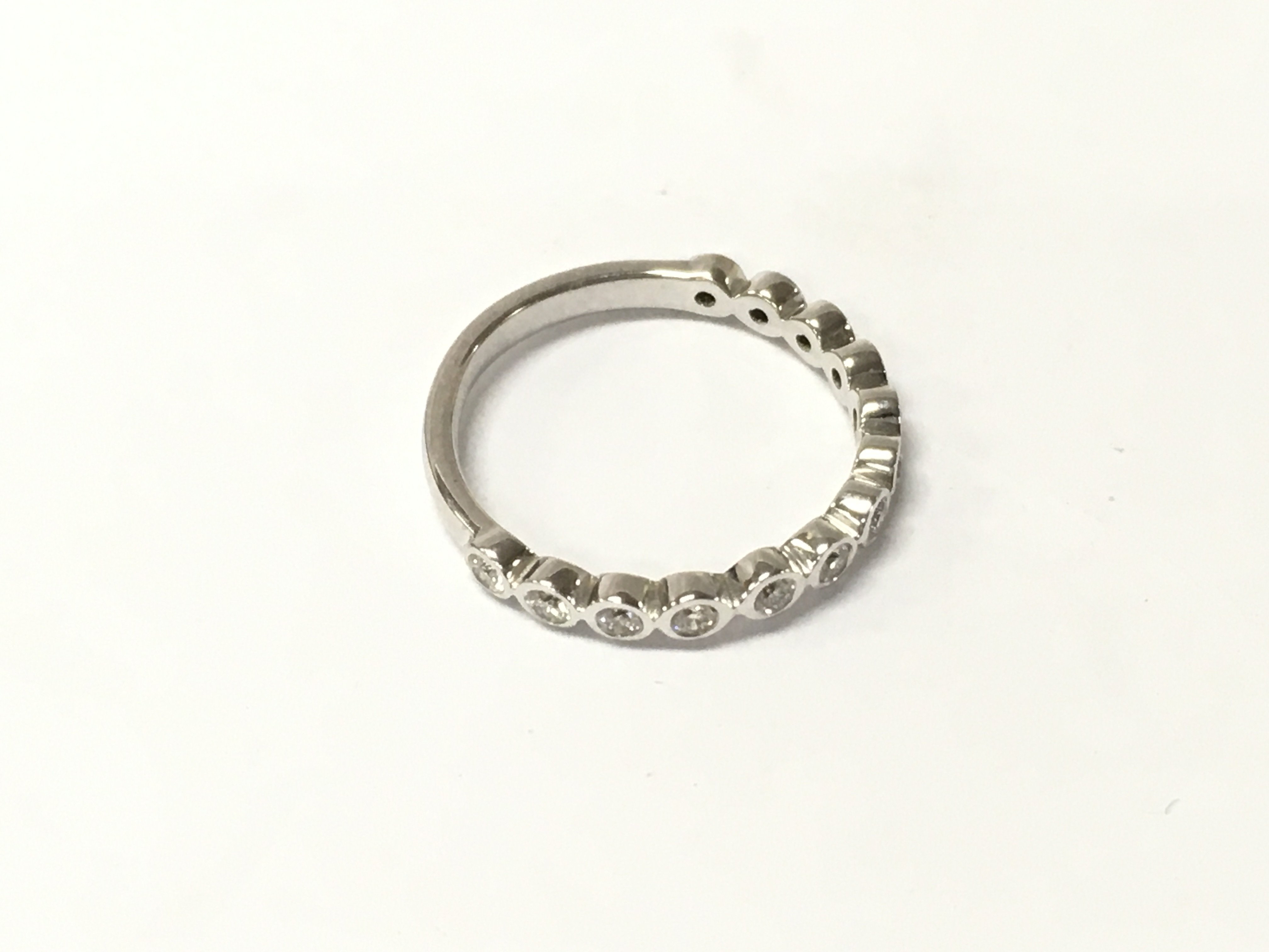 A 9ct white gold half eternity ring, Approx weight 2.17 grams. Size M.