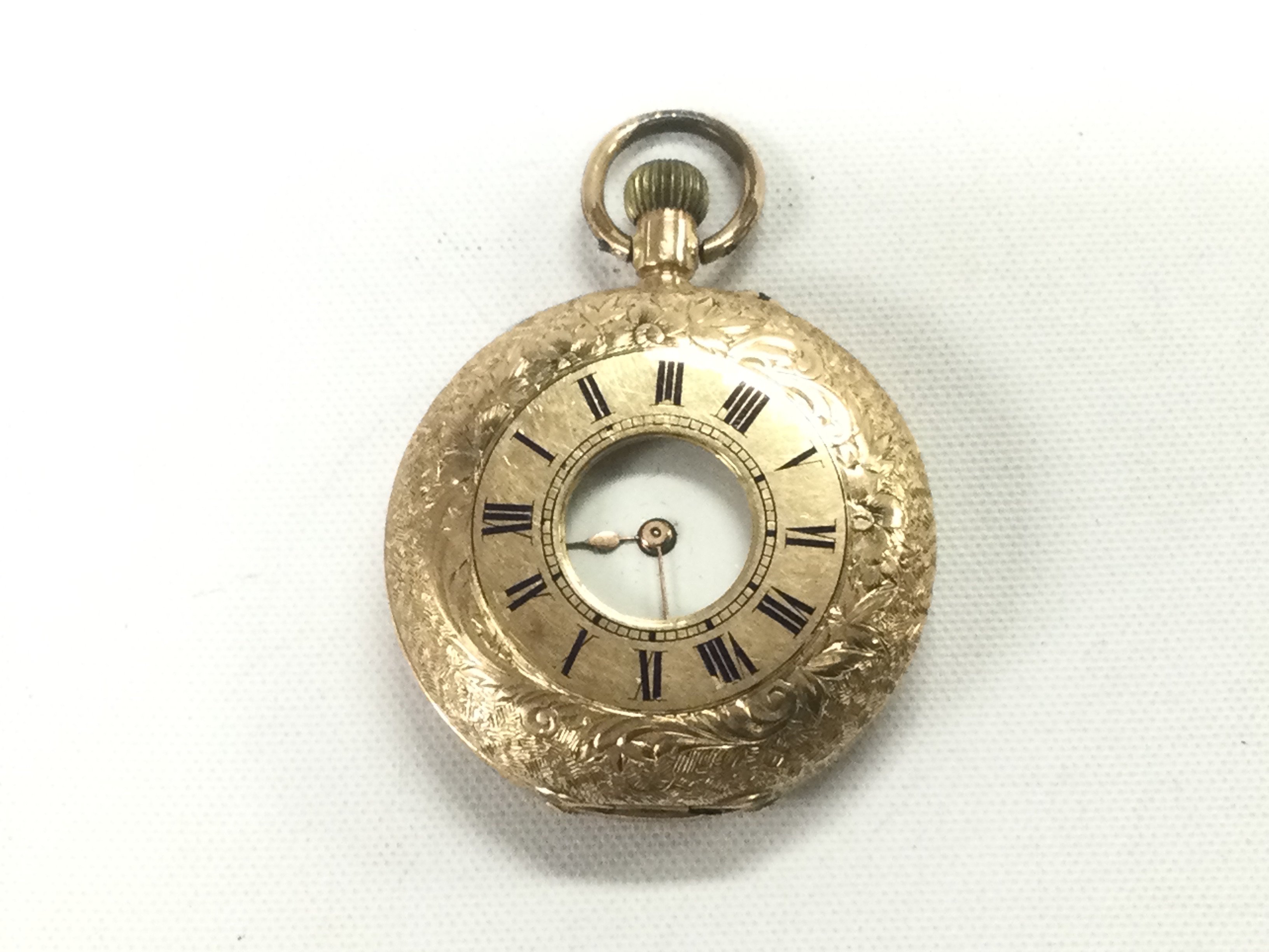 A 14k gold cased half hunter pocket watch. Shipping category A.
