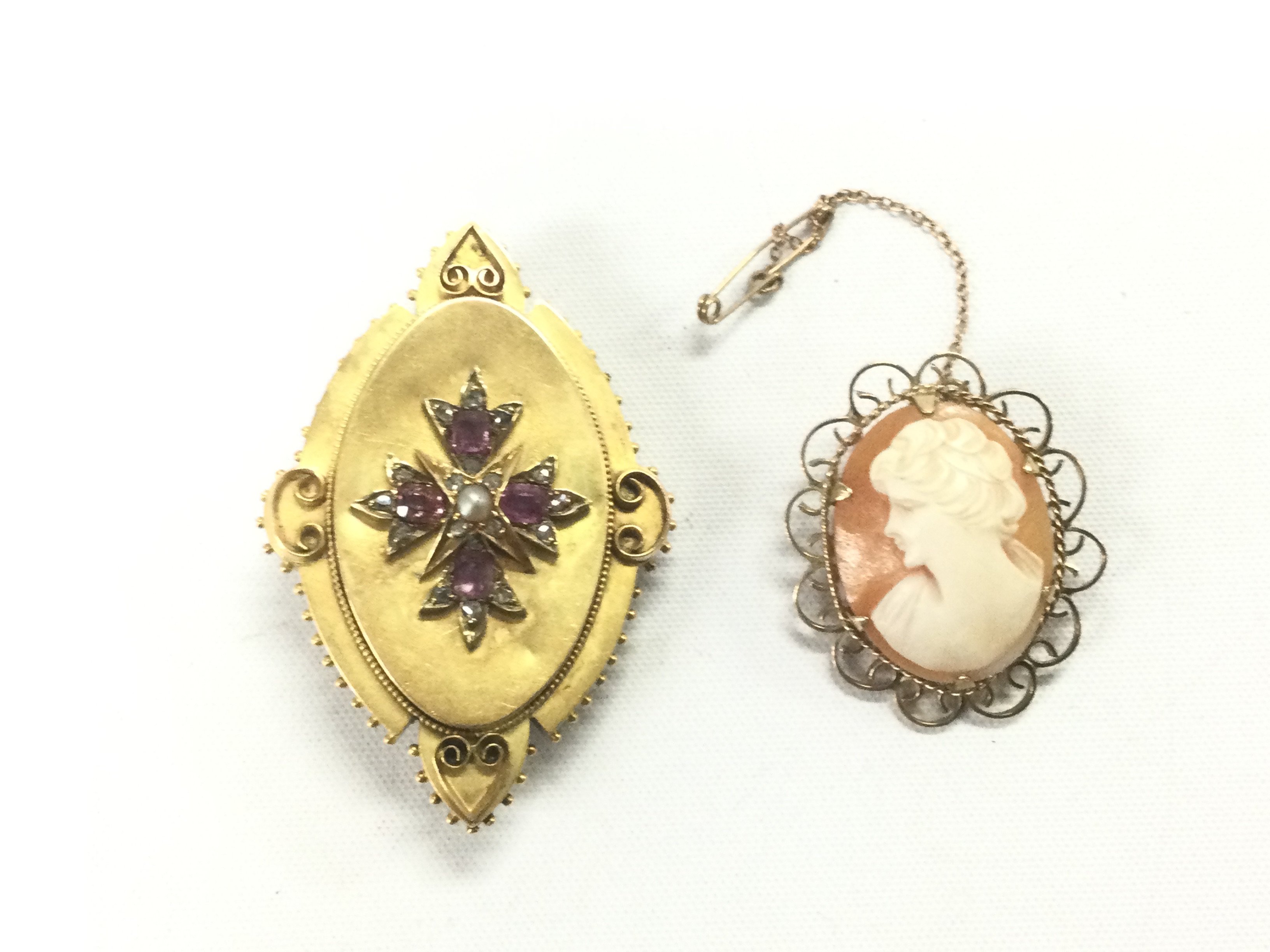 Two brooches including a 9ct gold cased cameo example. Shipping category A.