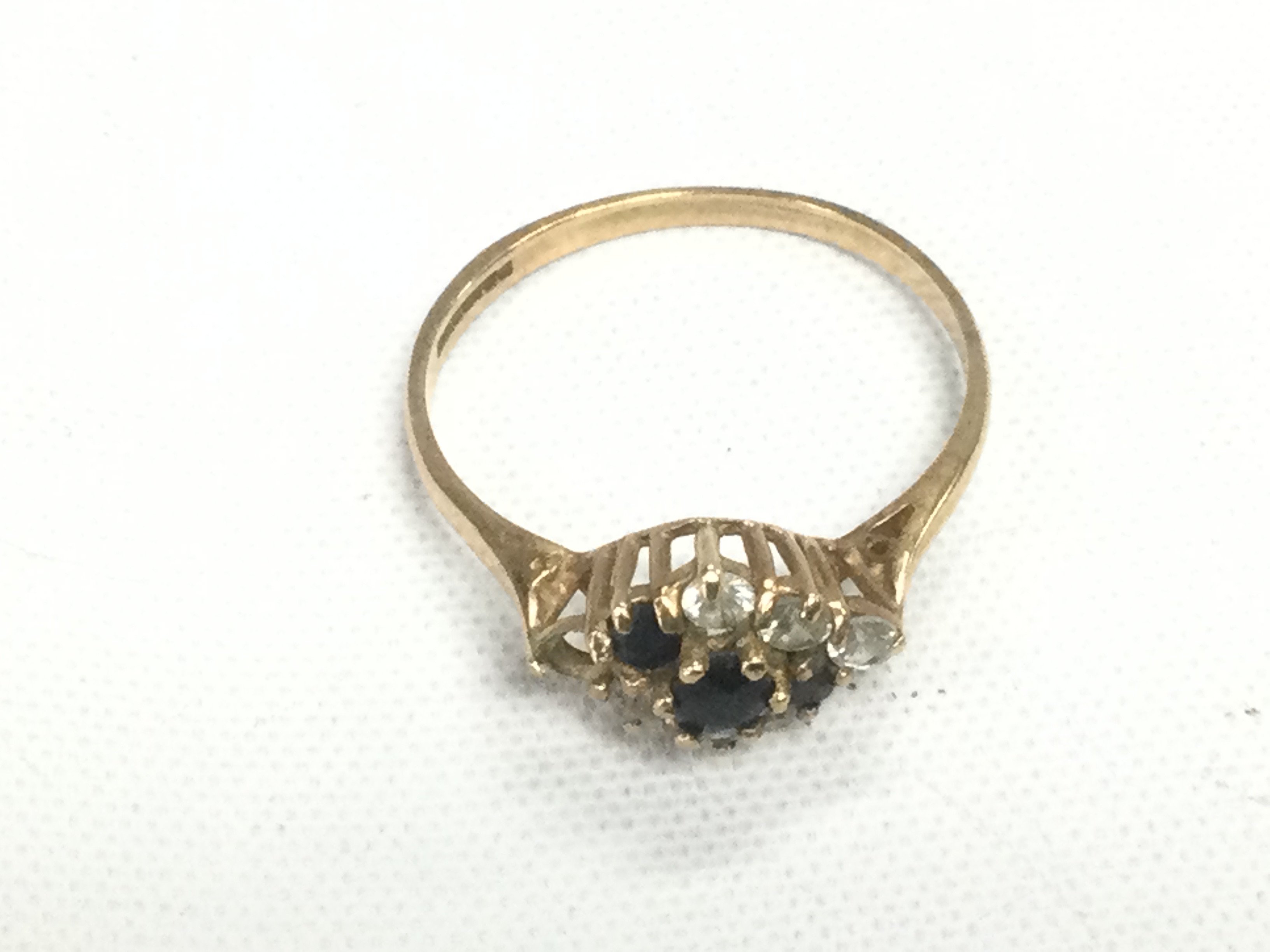 A 9ct gold ring set with stones, approx 1.4g and approx size N-O. Shipping category A.