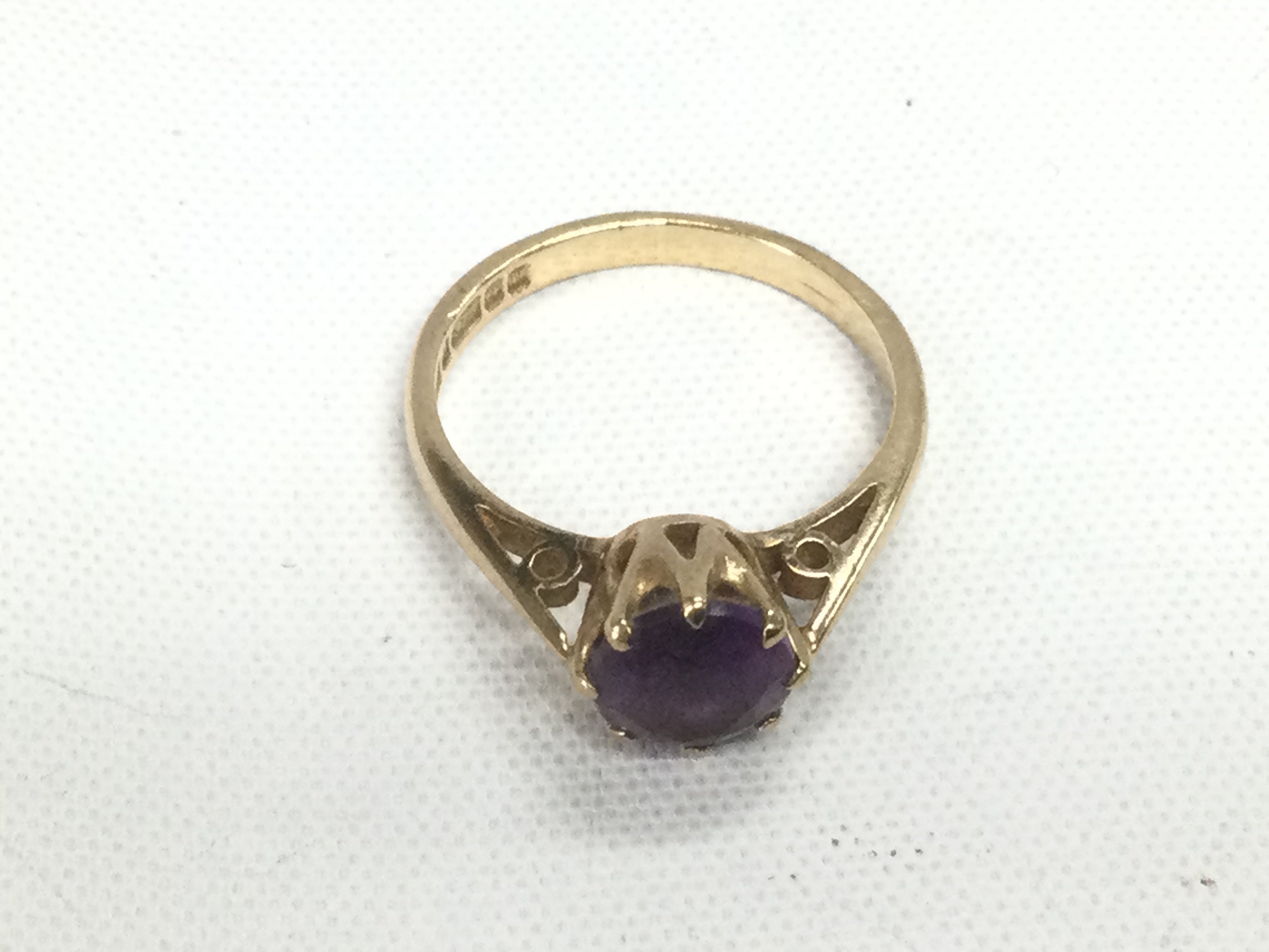 A 9ct gold ring set with an amethyst, approx 2.1g and approx size L. Shipping category A.