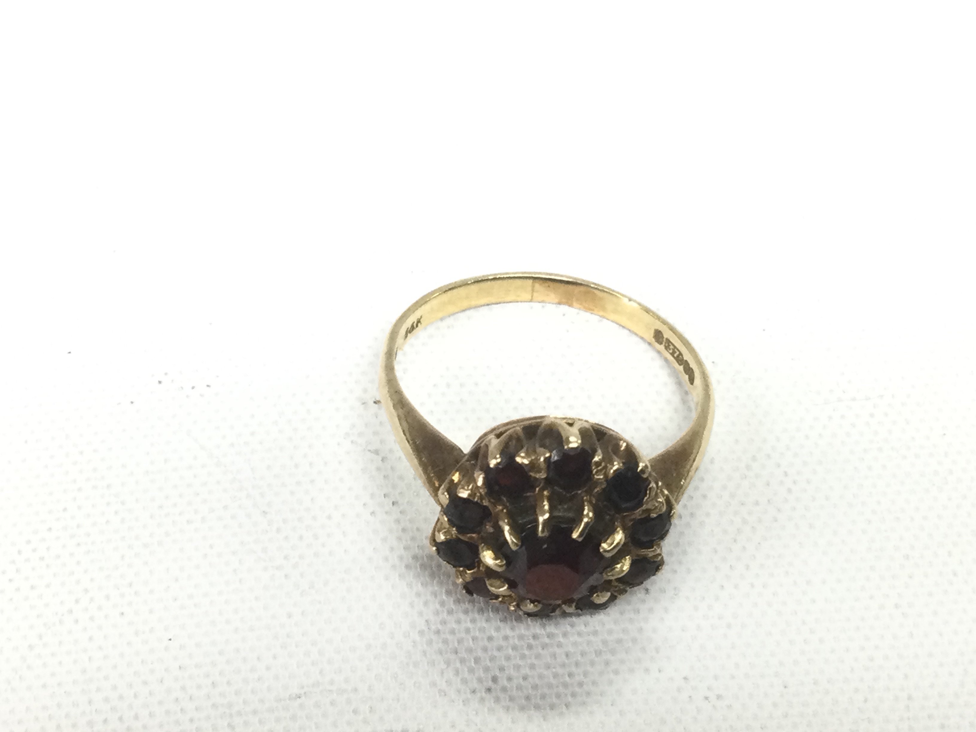 A 9ct gold ring set with rubies, approx 3.1g and approx size L. Shipping category A.
