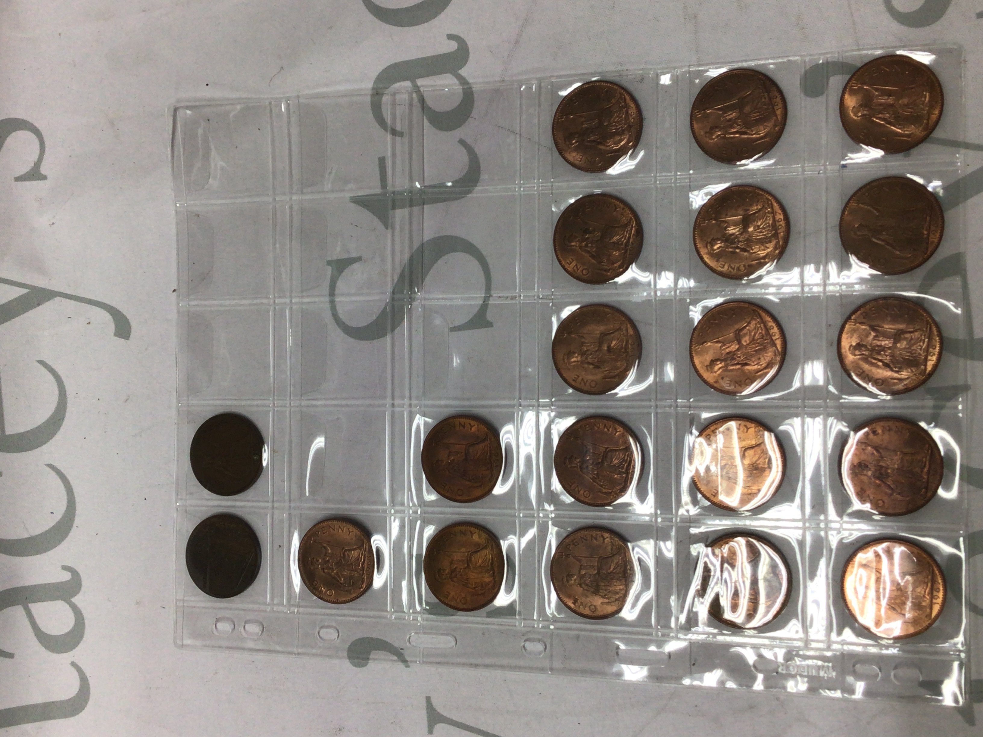 Ten sheets containing a collection of pre 1947 coinage and two separate coins